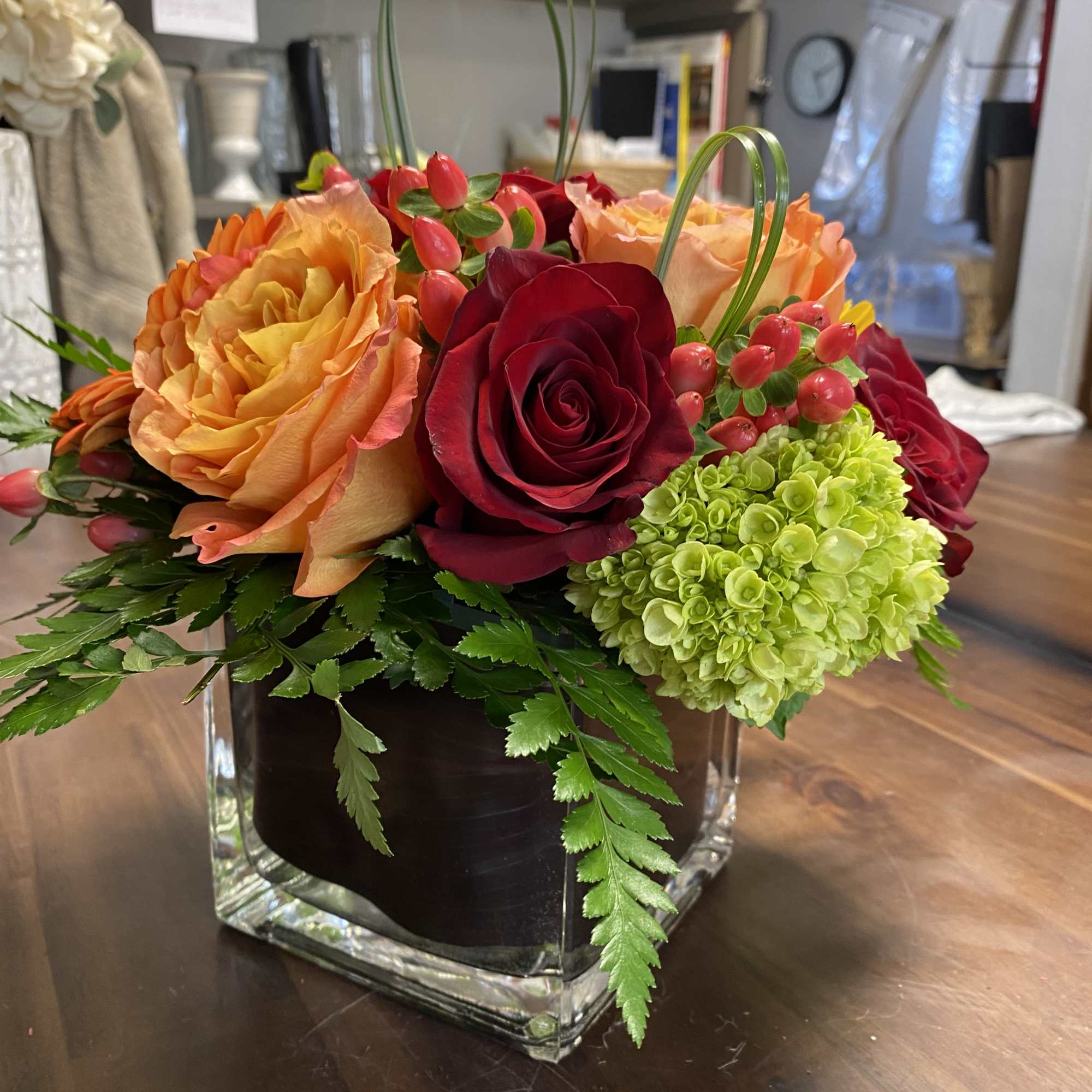 This arrangement includes roses, green hydrangea, seasonal flowers with beautiful filler. Spring