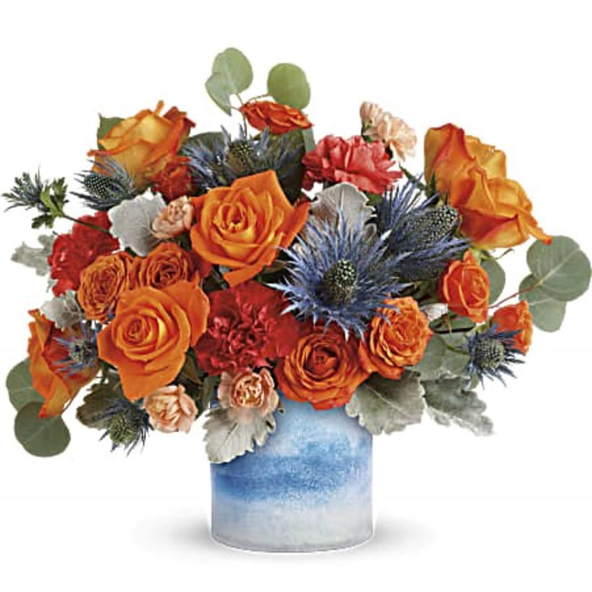 Tres chic! This high-fashion mix of bold orange roses and eye-catching blue