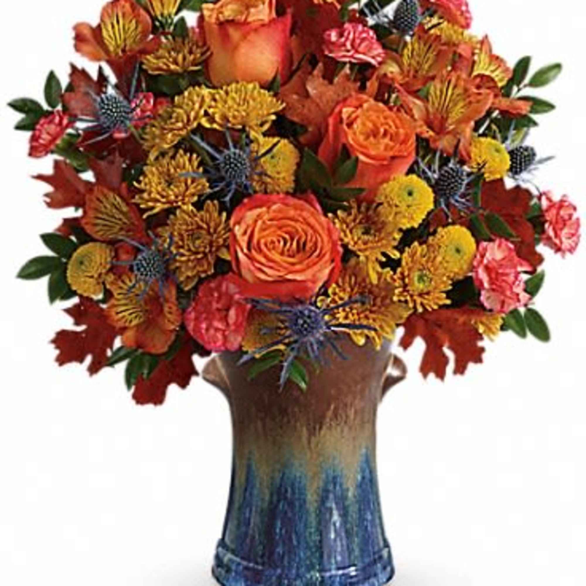Classic fall colors and a stunning stoneware vase make this arrangement an