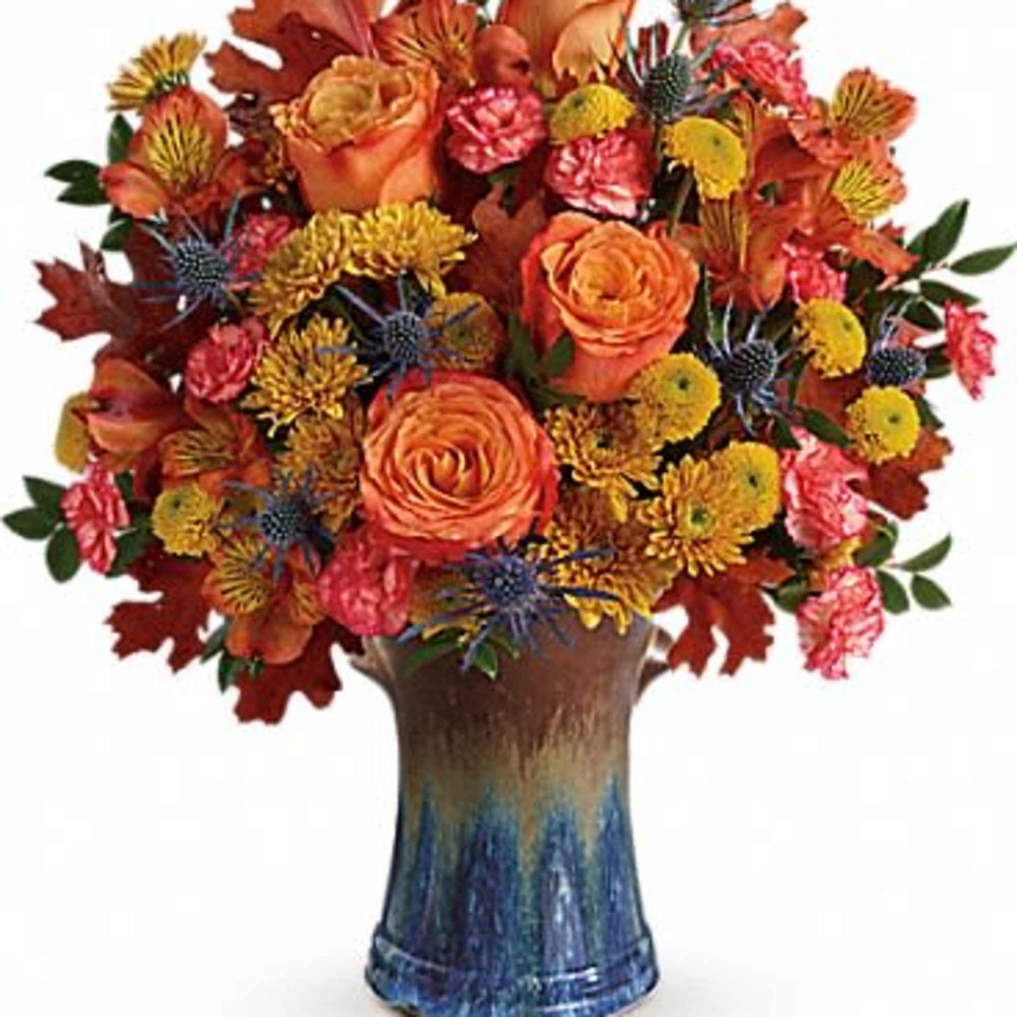 Classic fall colors and a stunning stoneware vase make this arrangement an