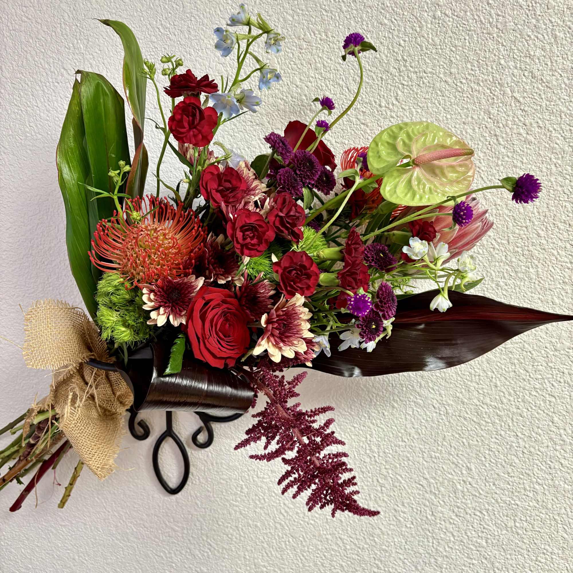 This drop includes Anthurium, Protea pincushion and tropical, Amaranthus, Dianthus, Red Roses