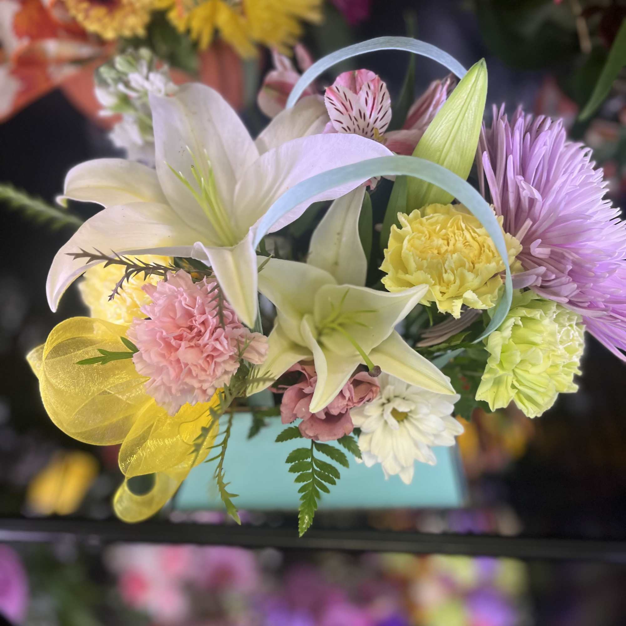 Fresh fall color flowers in purse setting 