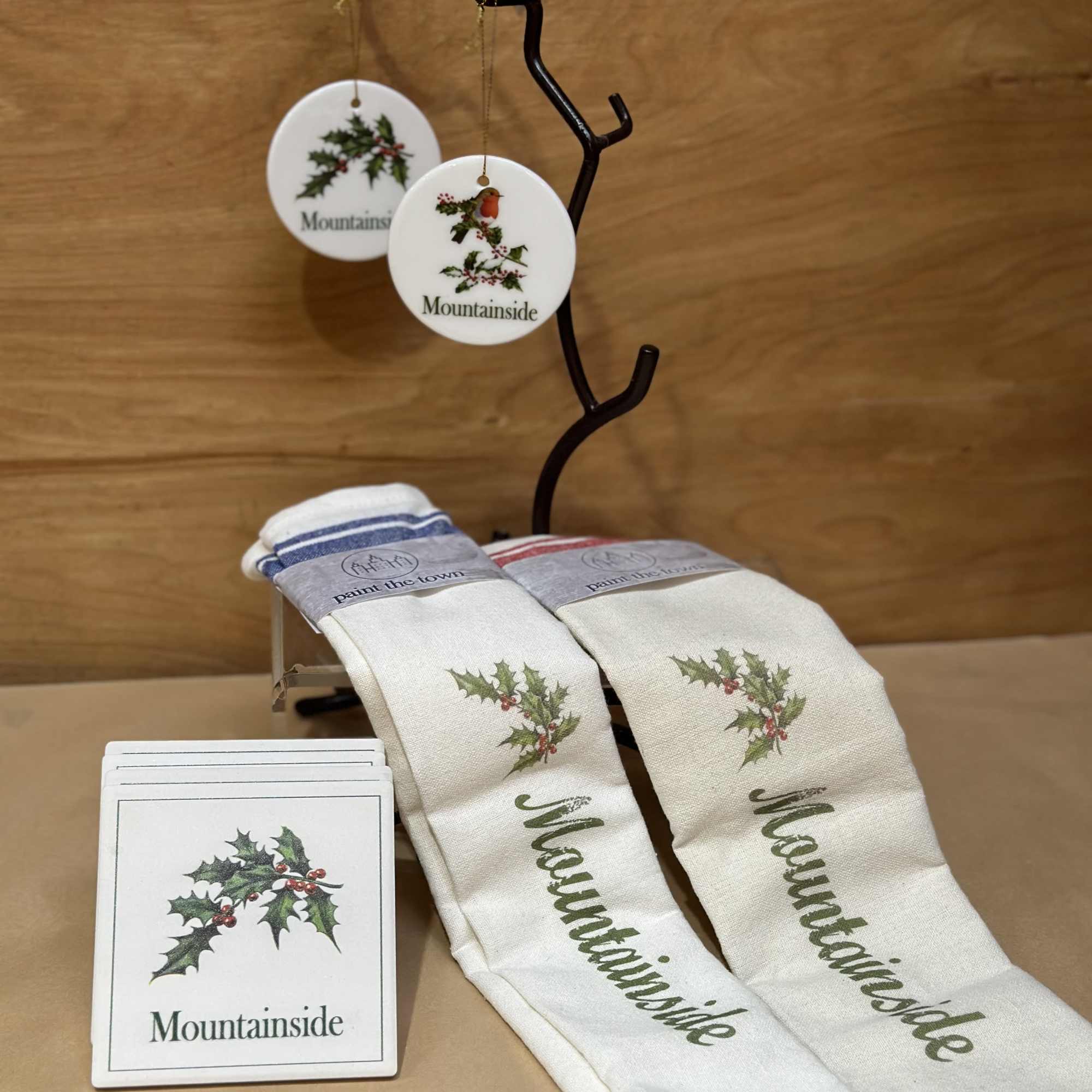 Two Holiday themed hand towels paired with 4 tile coasters and 2