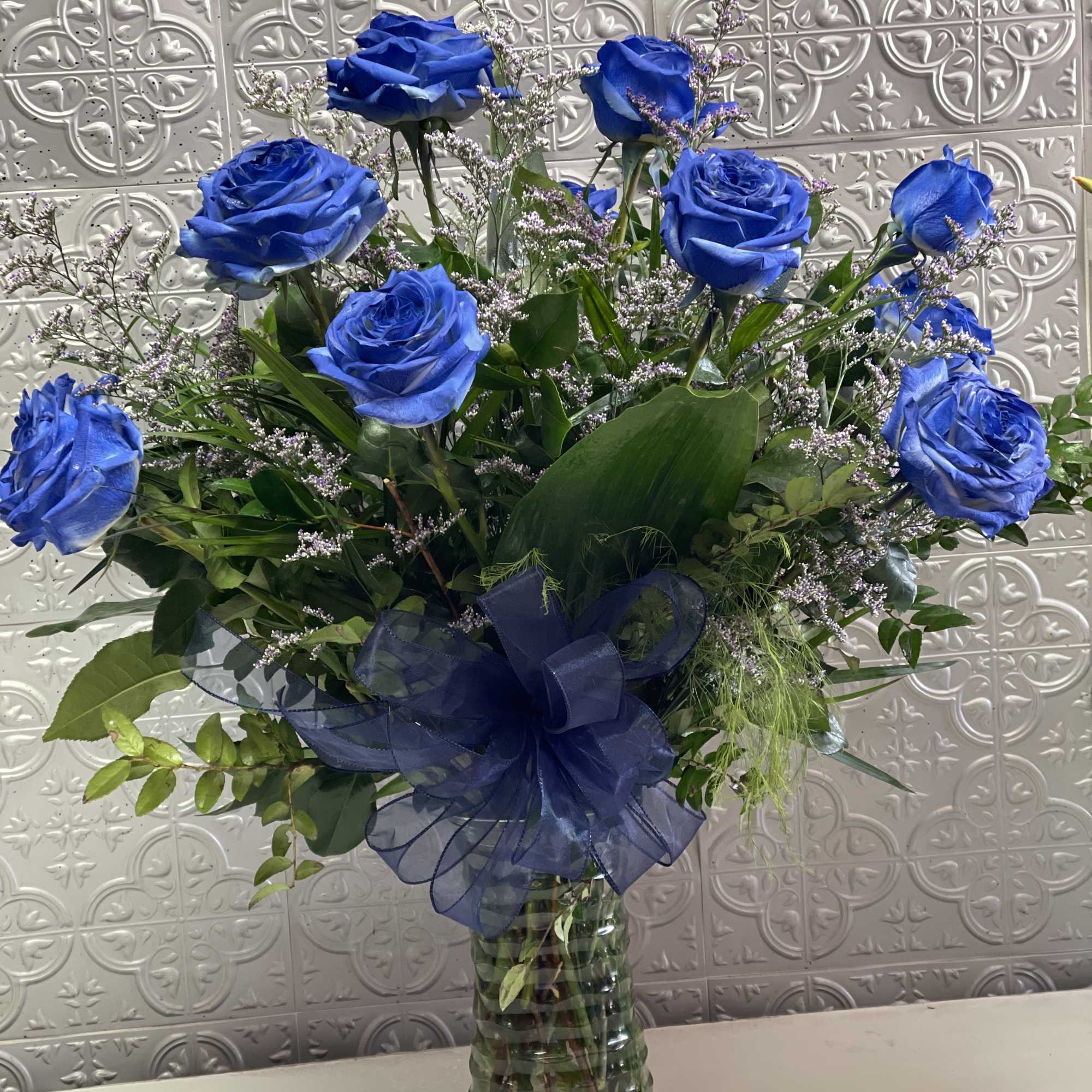 Blue tinted roses for any occasion . Standard 12, deluxe 18 and
