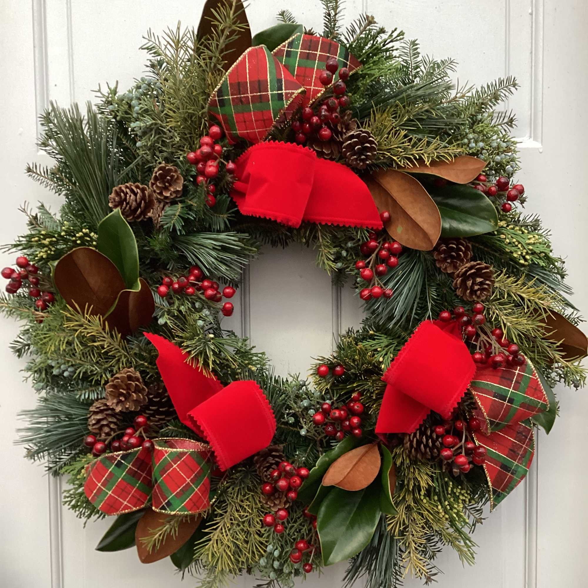 Simple yet beautiful, this traditional, door sized wreath is accented with artificial