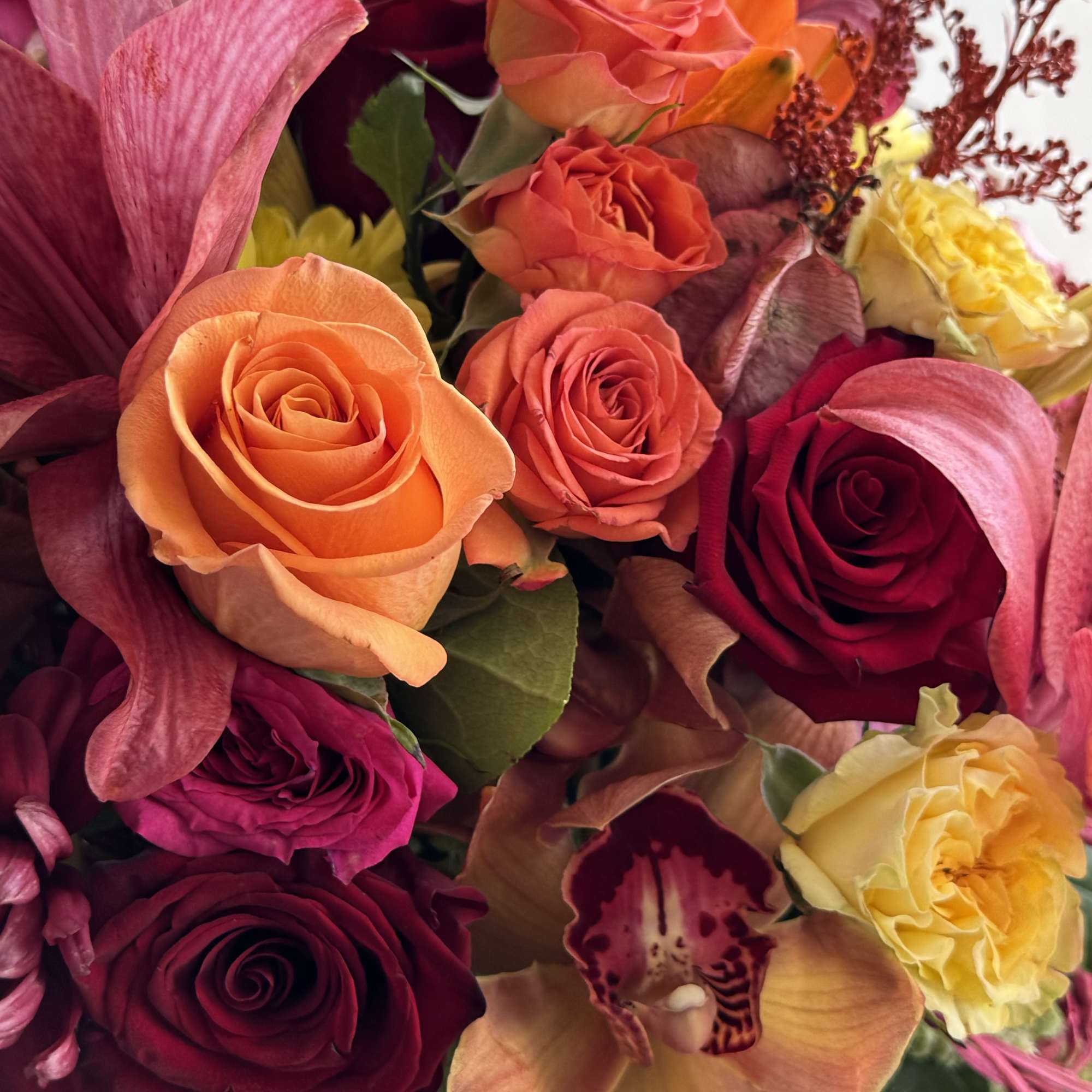 Capture the vibrant spirit of fall with our stunning Lily Cornucopia. This