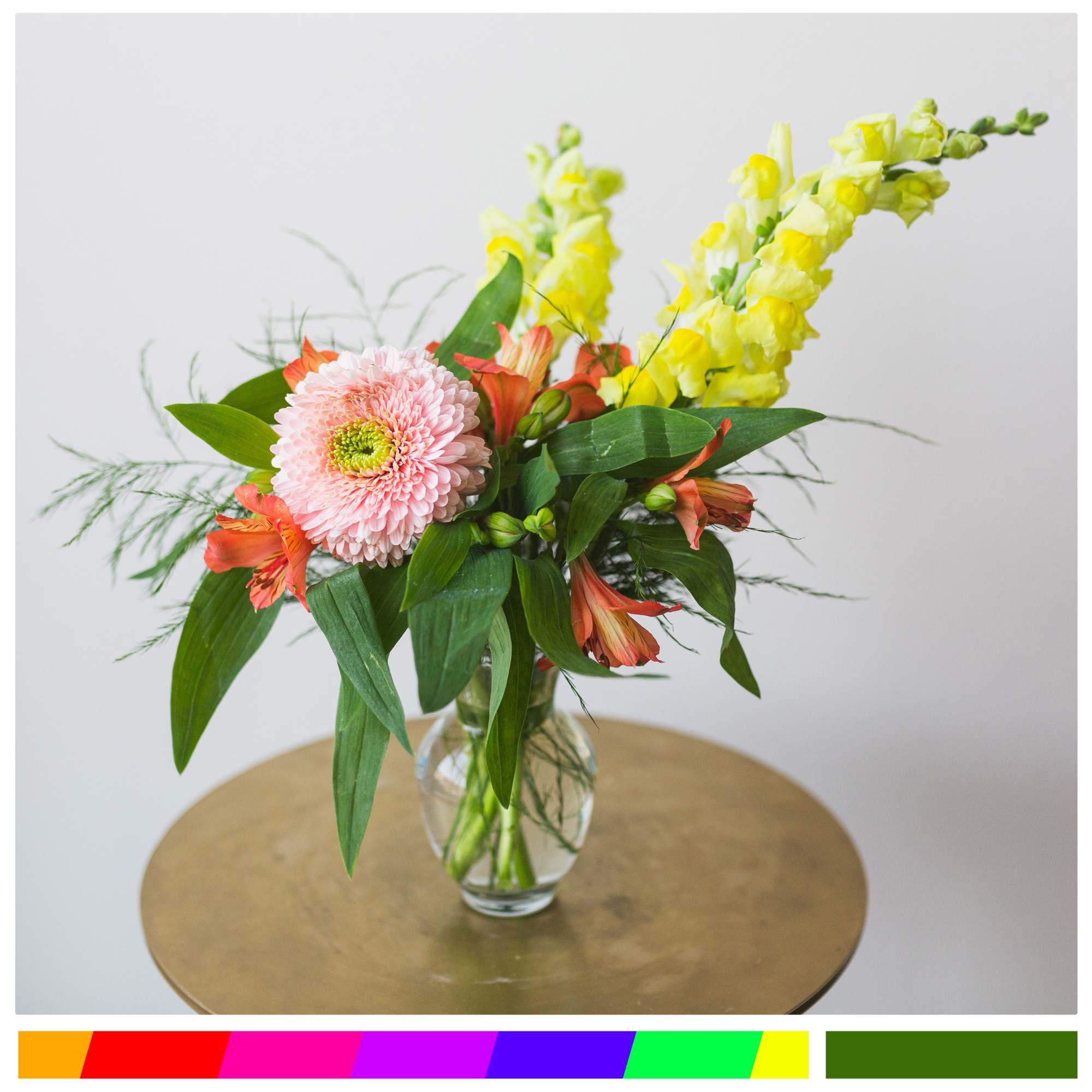 A small garden vase filled with bright blooms.

*Colors may vary based on