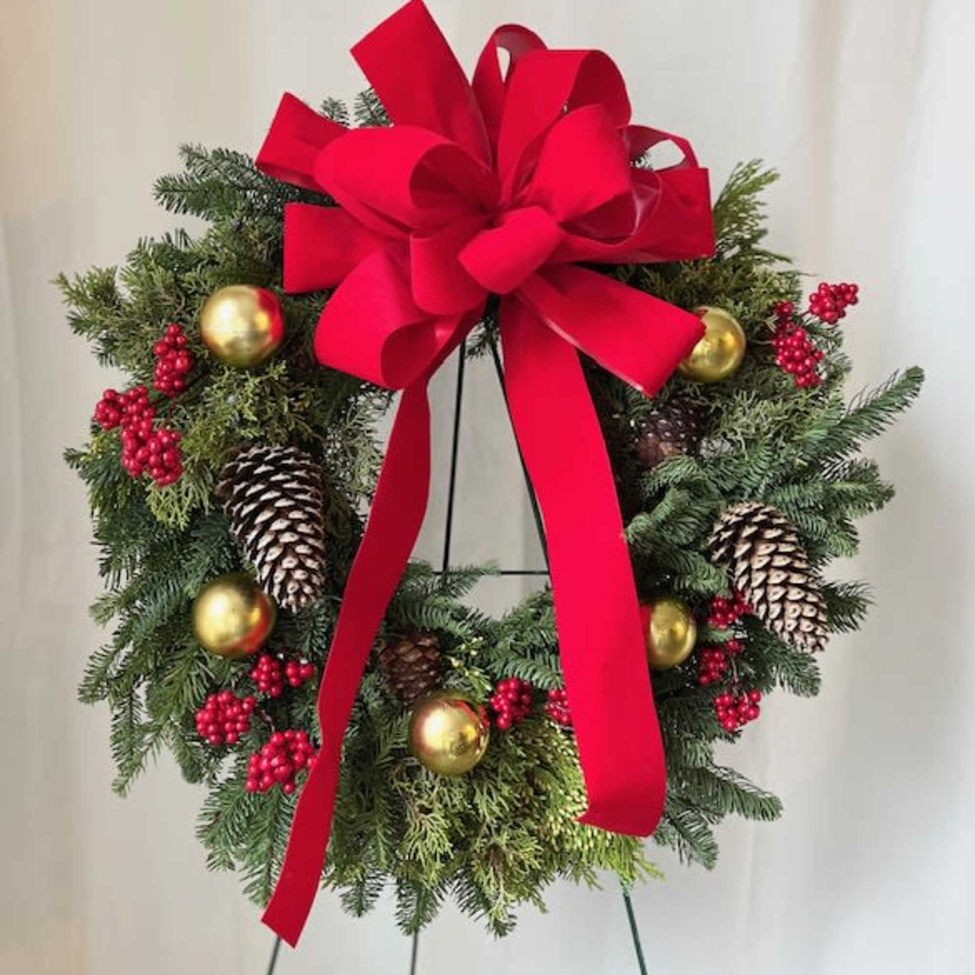 The Home for the Holidays Wreath is a fresh wreath that includes
