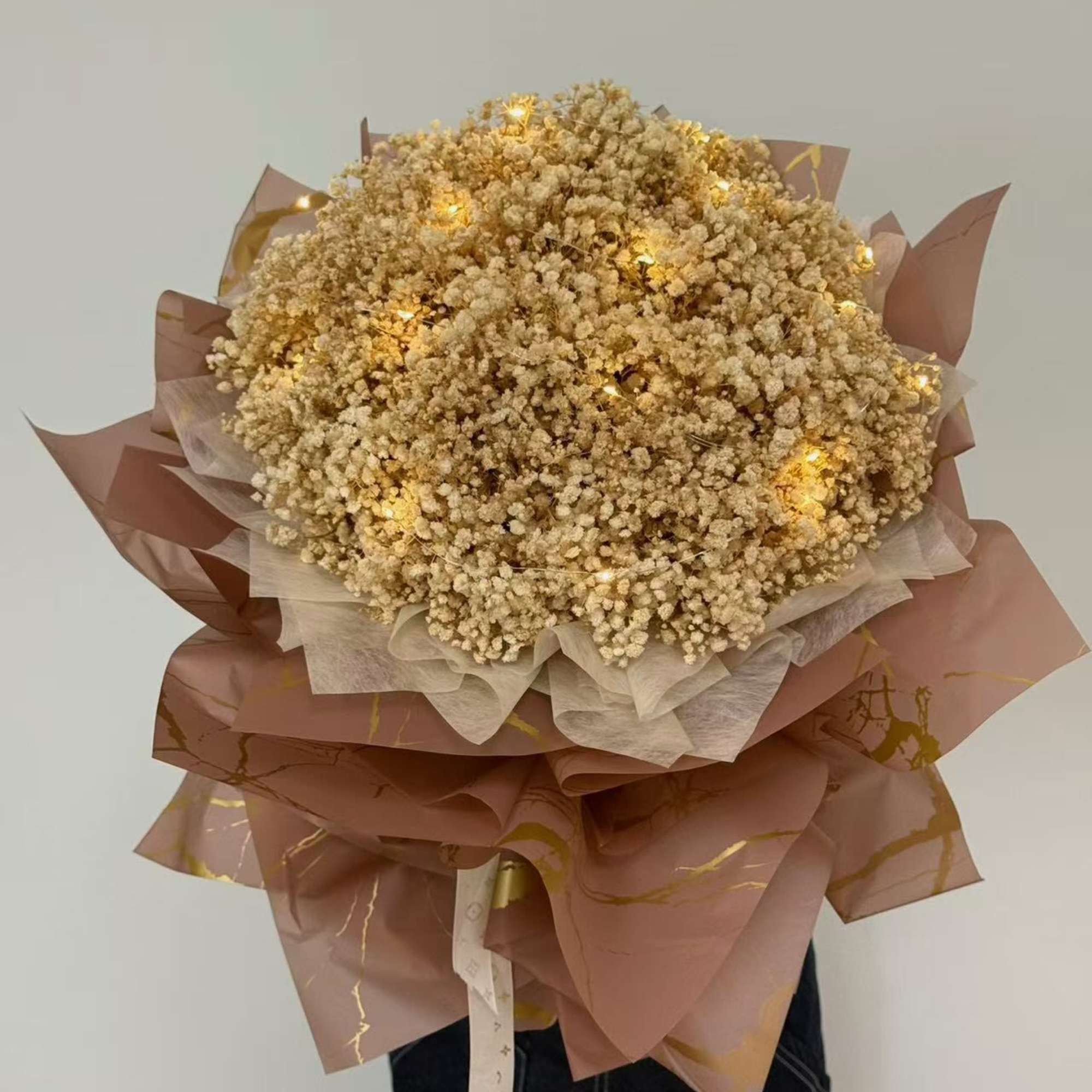 A luxurious  preserved full Baby,s breath bouquet in soft champagne-gold tones