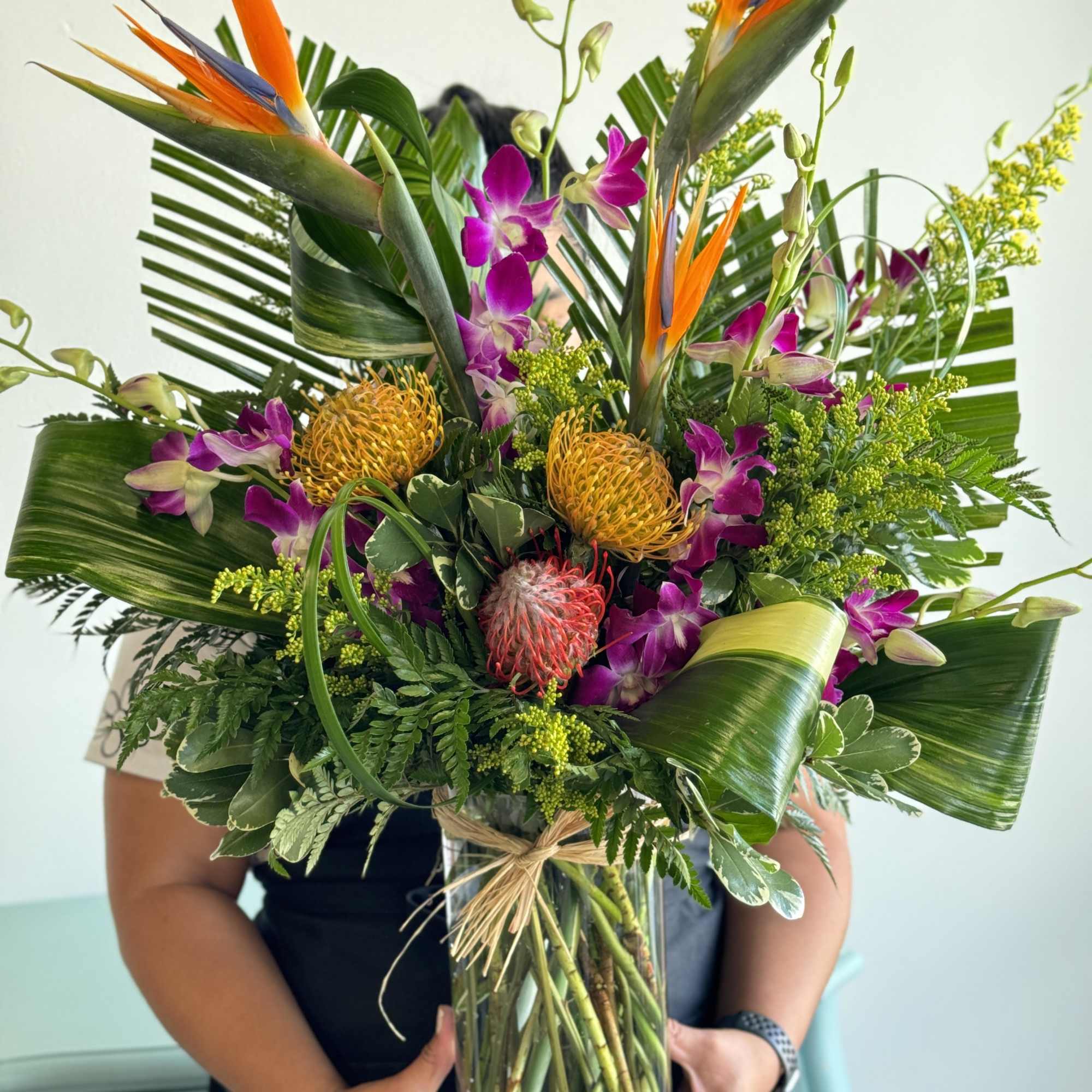 Like a tropical island breeze this eye catching arrangement will capture that