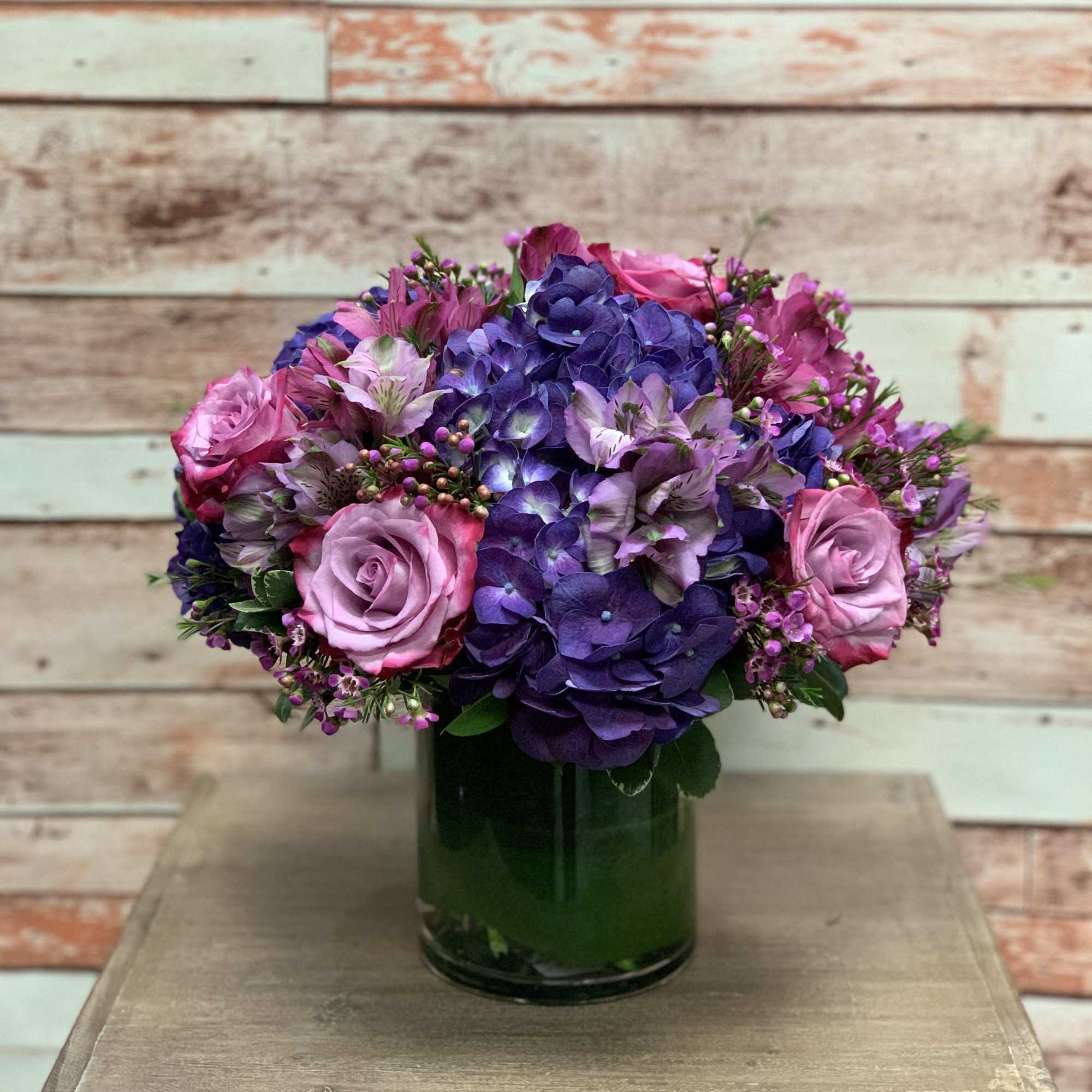 A beautiful arrangement full or purple and magenta colored flowers perfect for
