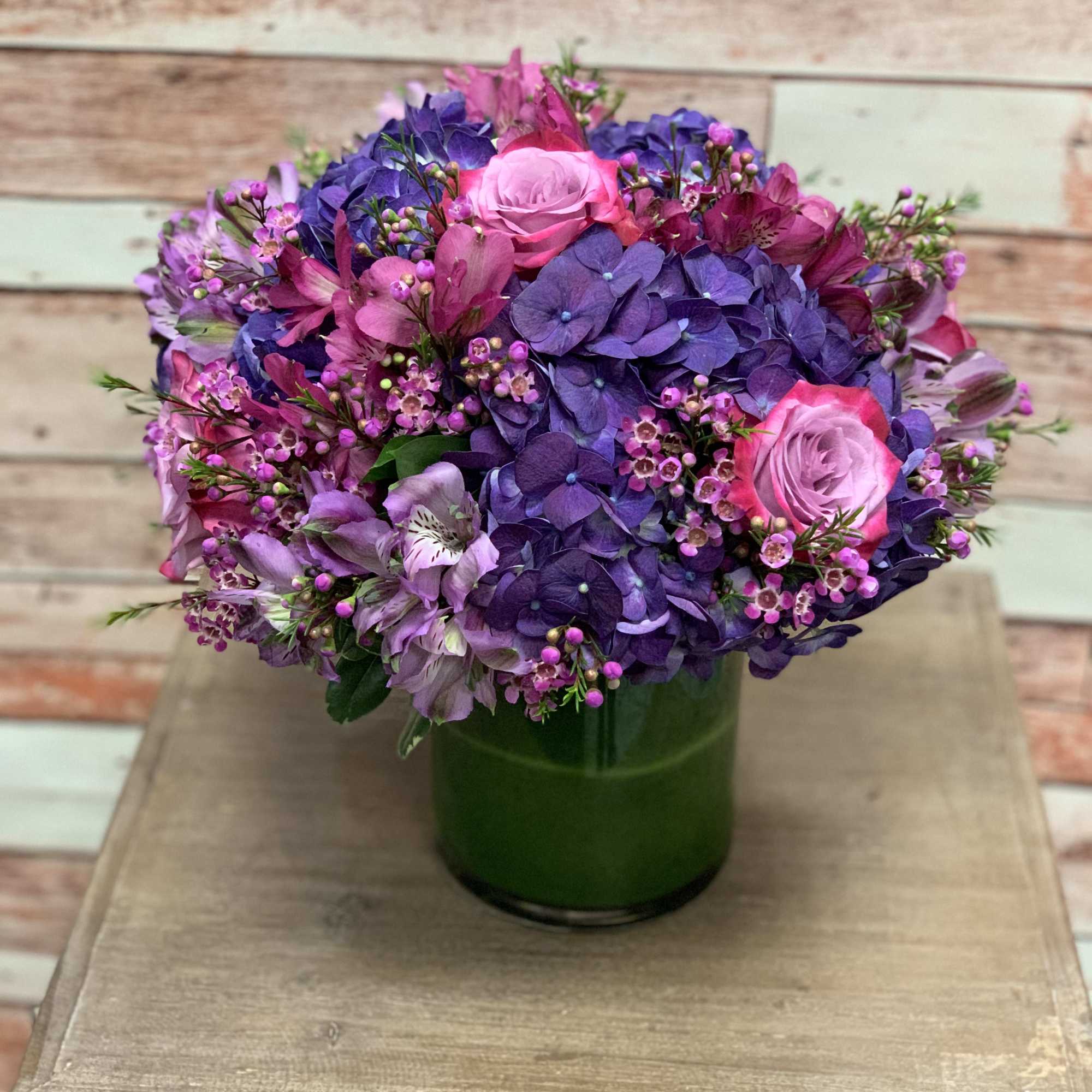 A beautiful arrangement full or purple and magenta colored flowers perfect for
