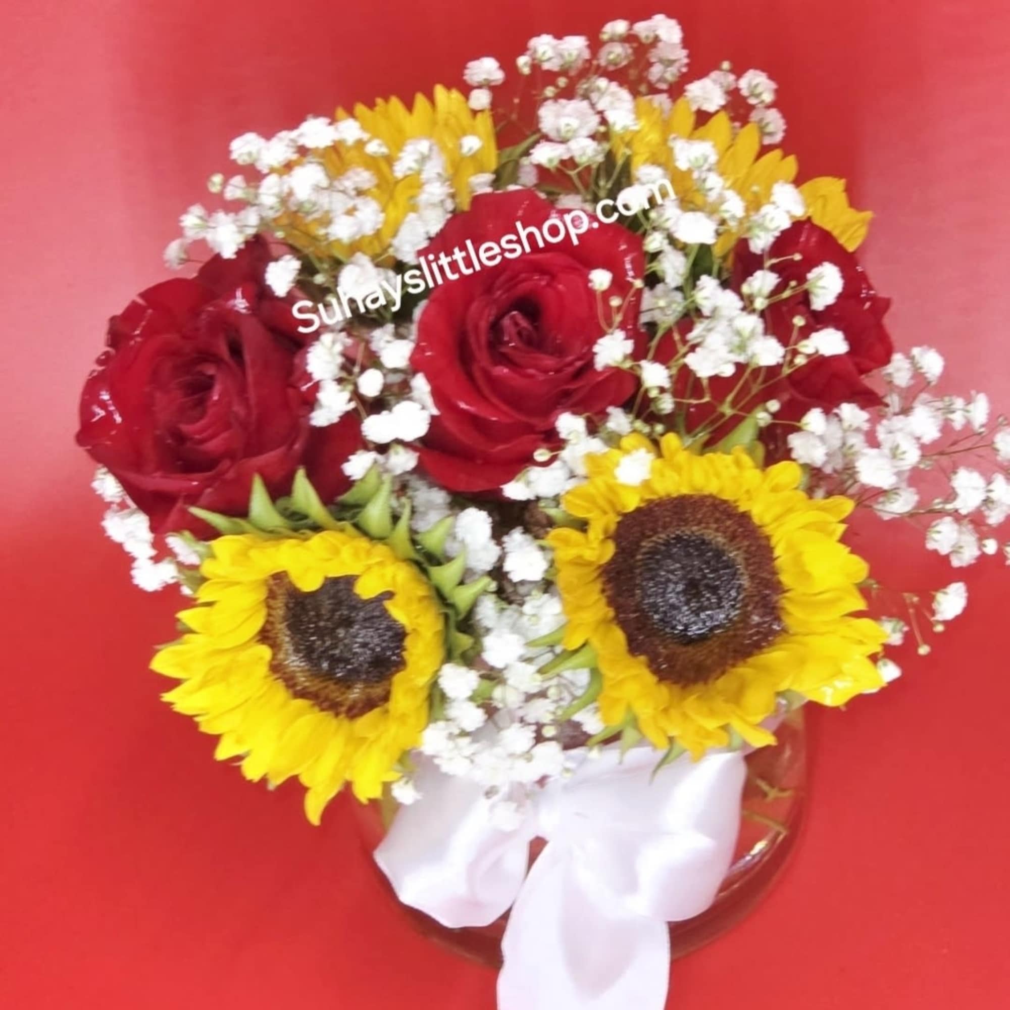 Romantic fall mood floral arrangement featuring purple-red sunflowers and warm autumn lighting.