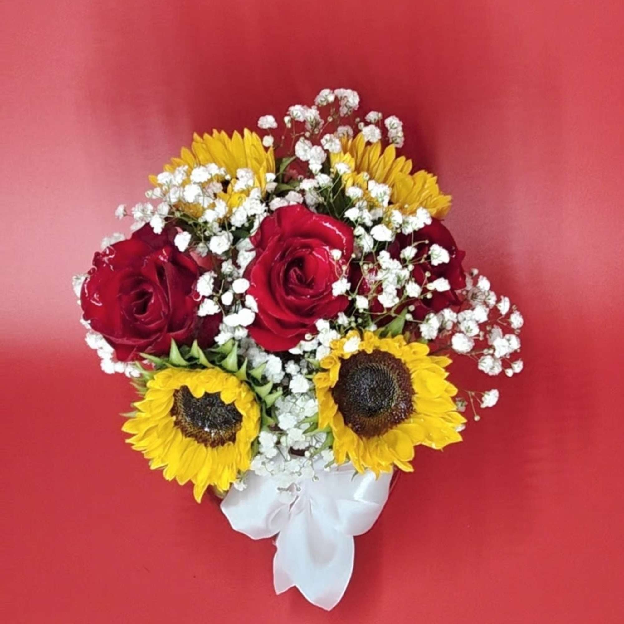 Romantic fall mood floral arrangement featuring purple-red sunflowers and warm autumn lighting.