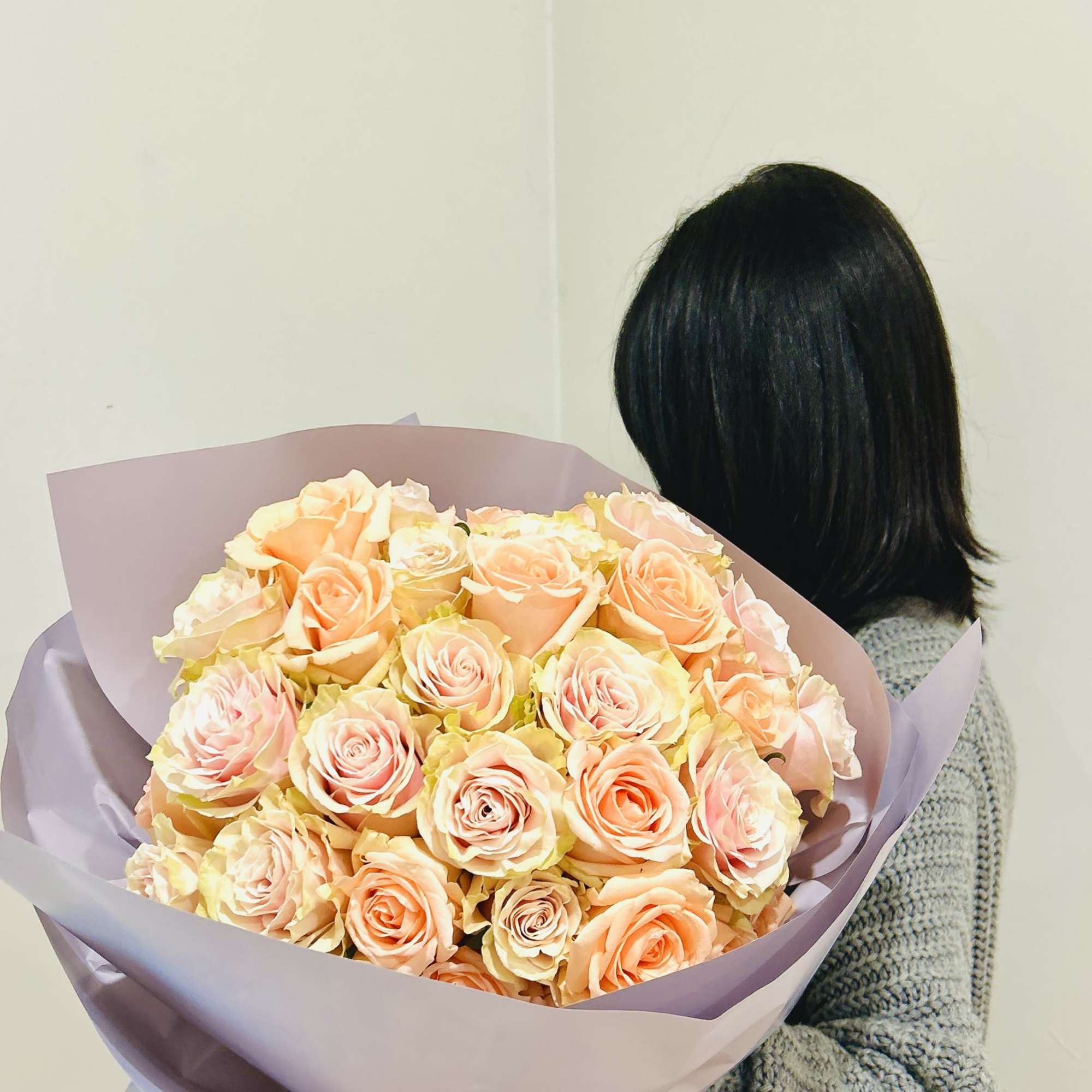 The bouquet has 4 dozen (48) of mixed light pink and peach!