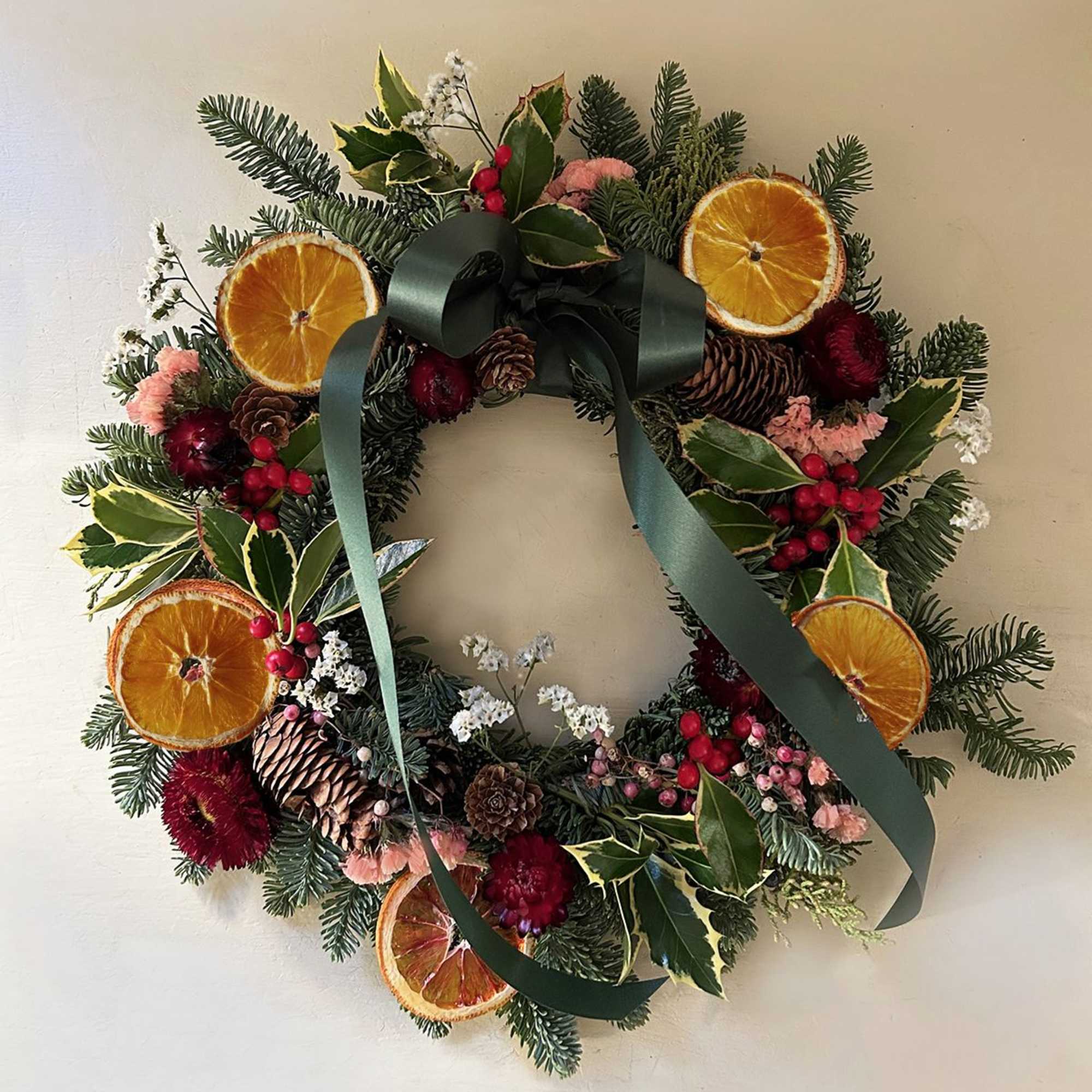 A beautiful, classic holiday wreath for outdoors and indoors. A base of