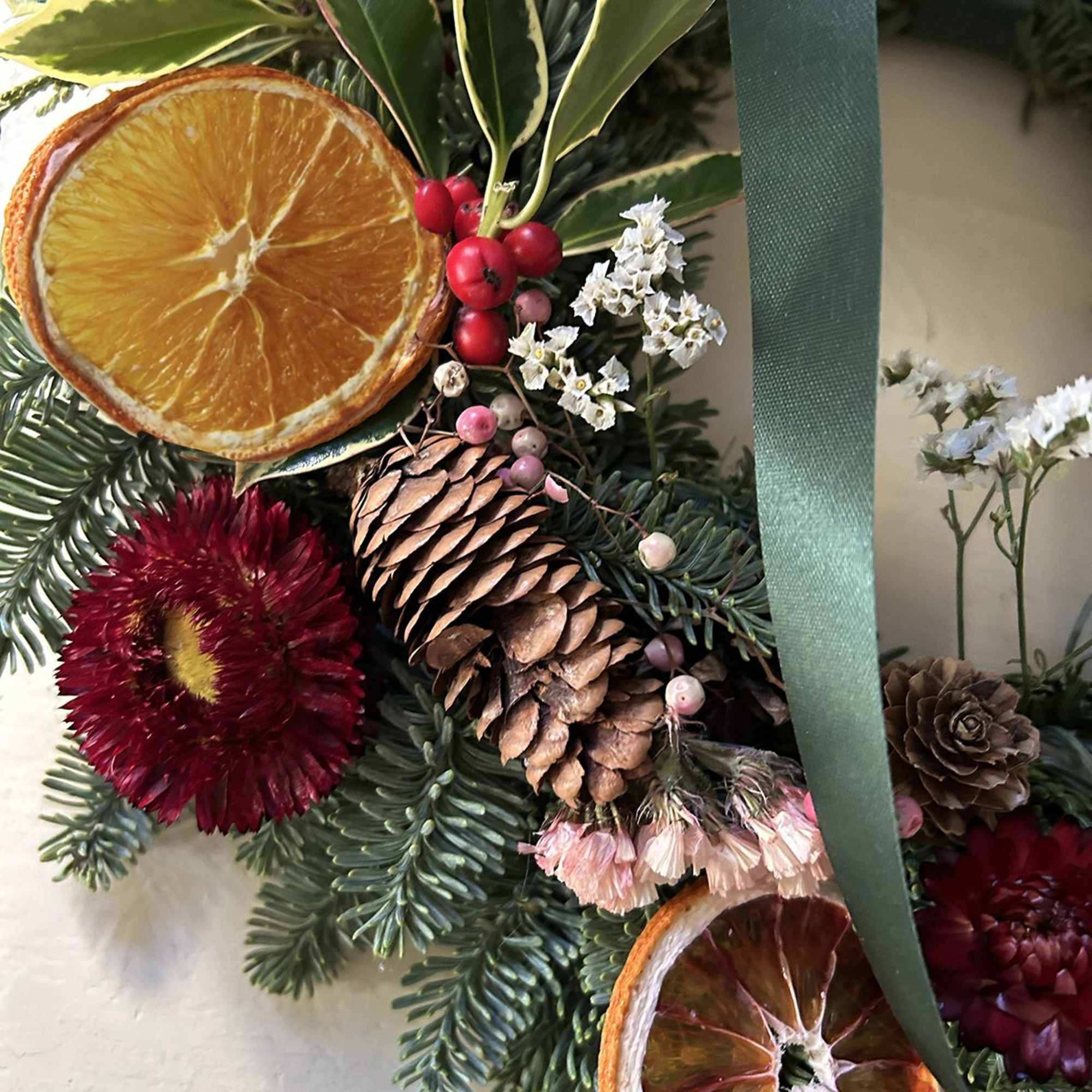 A beautiful, classic holiday wreath for outdoors and indoors. A base of