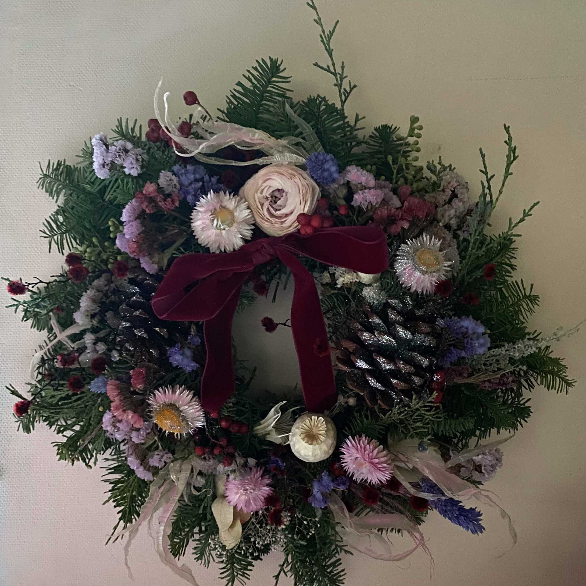 The most lovely wreath for the Holiday season of pine cones, dried