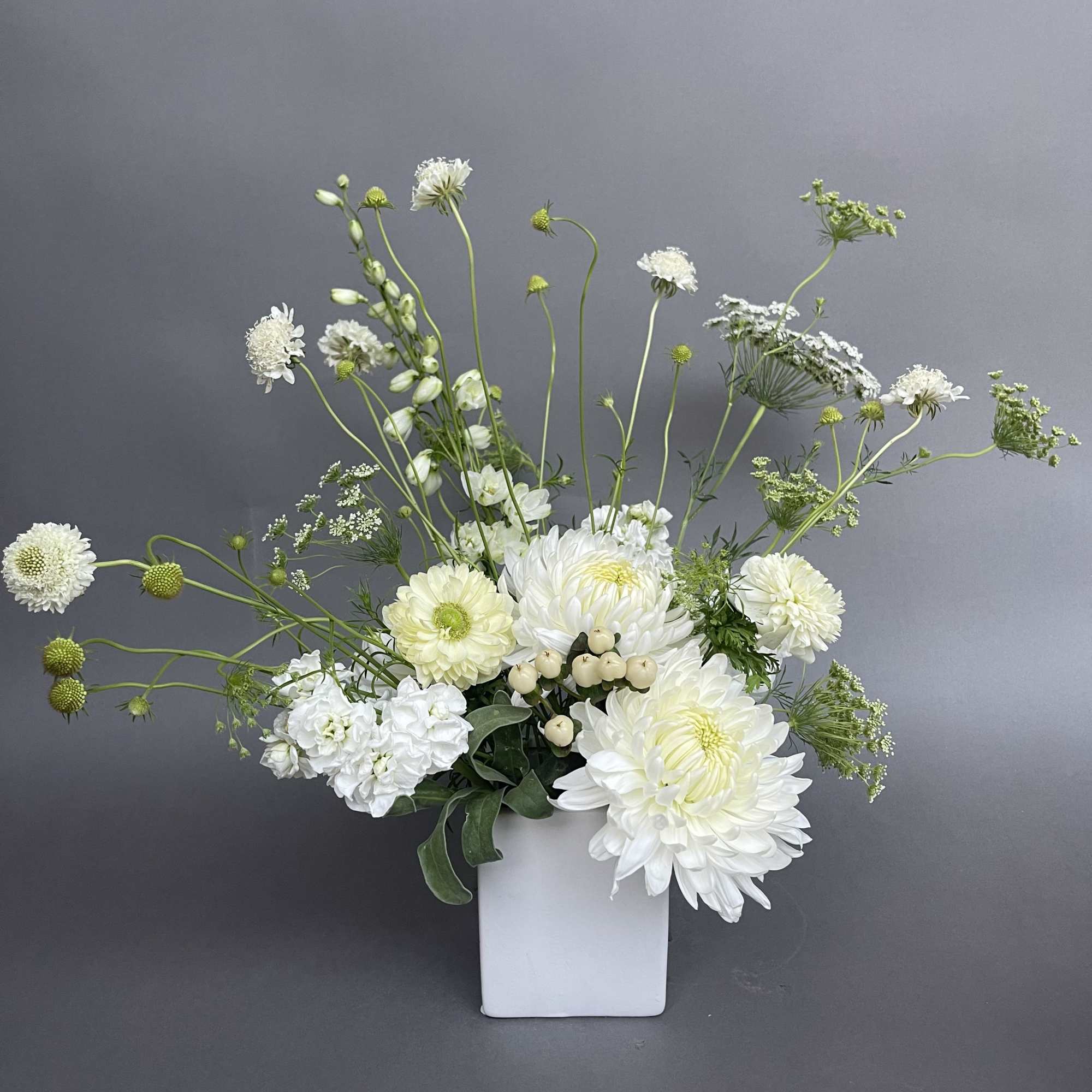 An all white lovely modern wild flower design. 