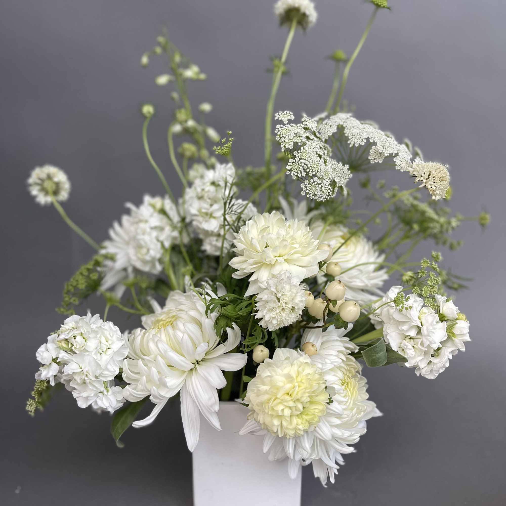An all white lovely modern wild flower design. 