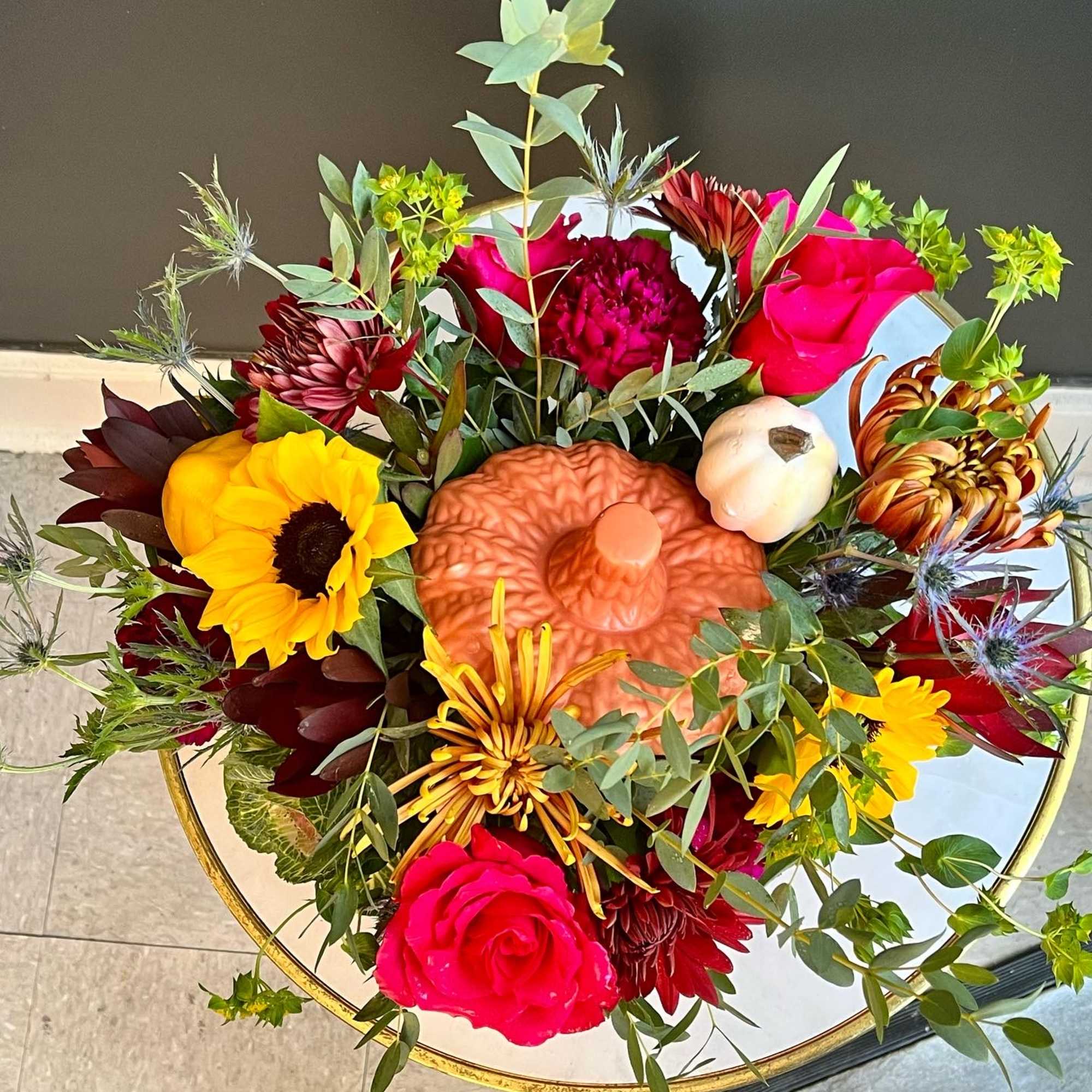 Fall assortment of Sunflowers, Leucadendron, Mums, Waxflower, Spray Roses and Assorted Greenery