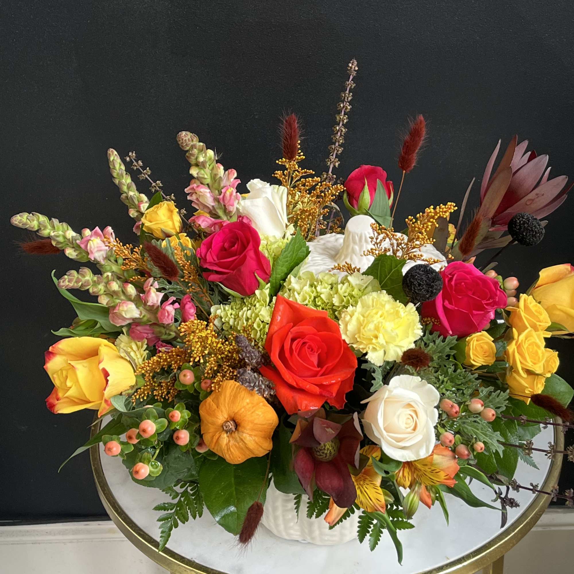 Fall assortment of Sunflowers, Leucadendron, Mums, Waxflower, Spray Roses and Assorted Greenery