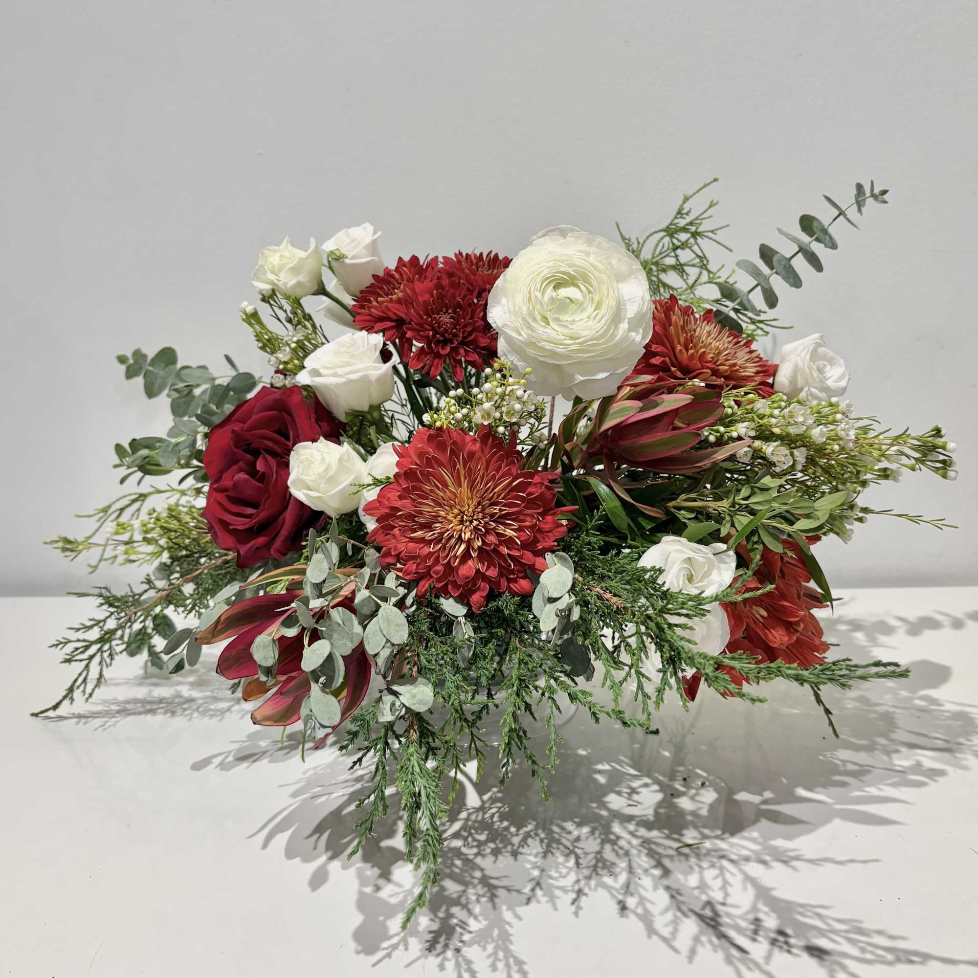 Celebrate the season with this luxurious Christmas centerpiece of Red, White and