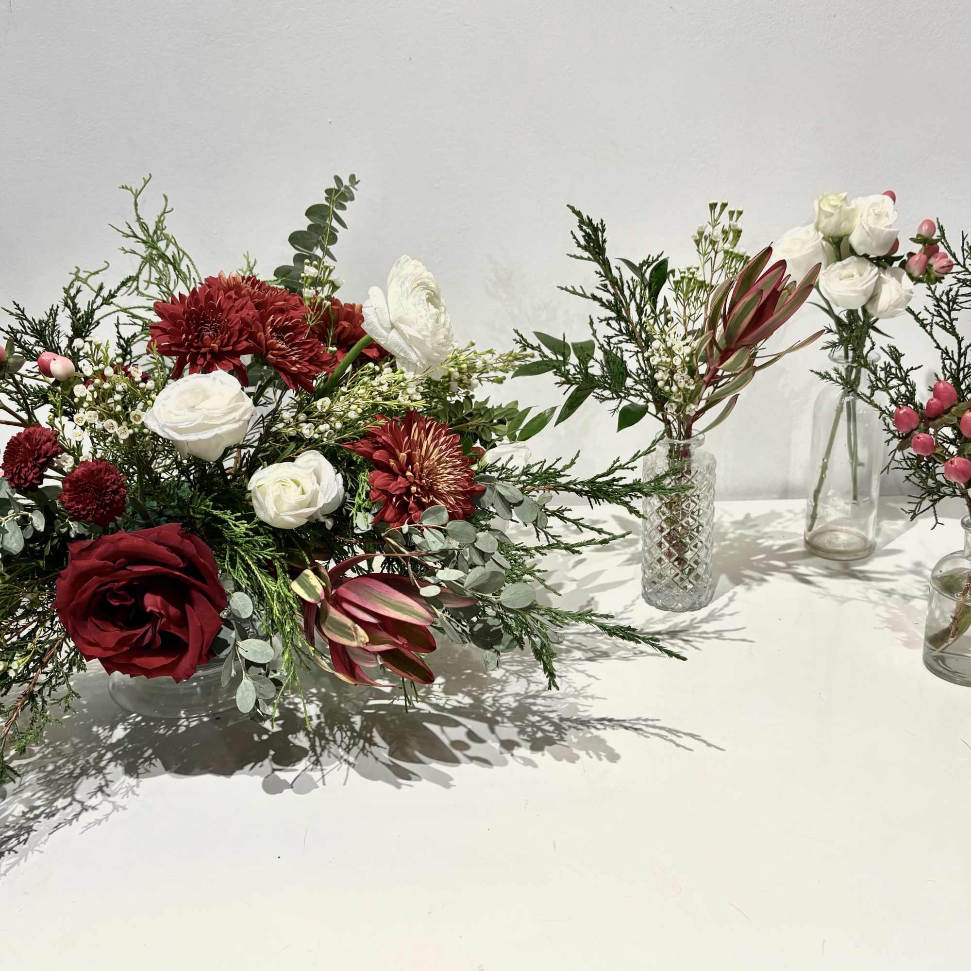 Celebrate the season with this red, white and green Christmas centerpiece featuring