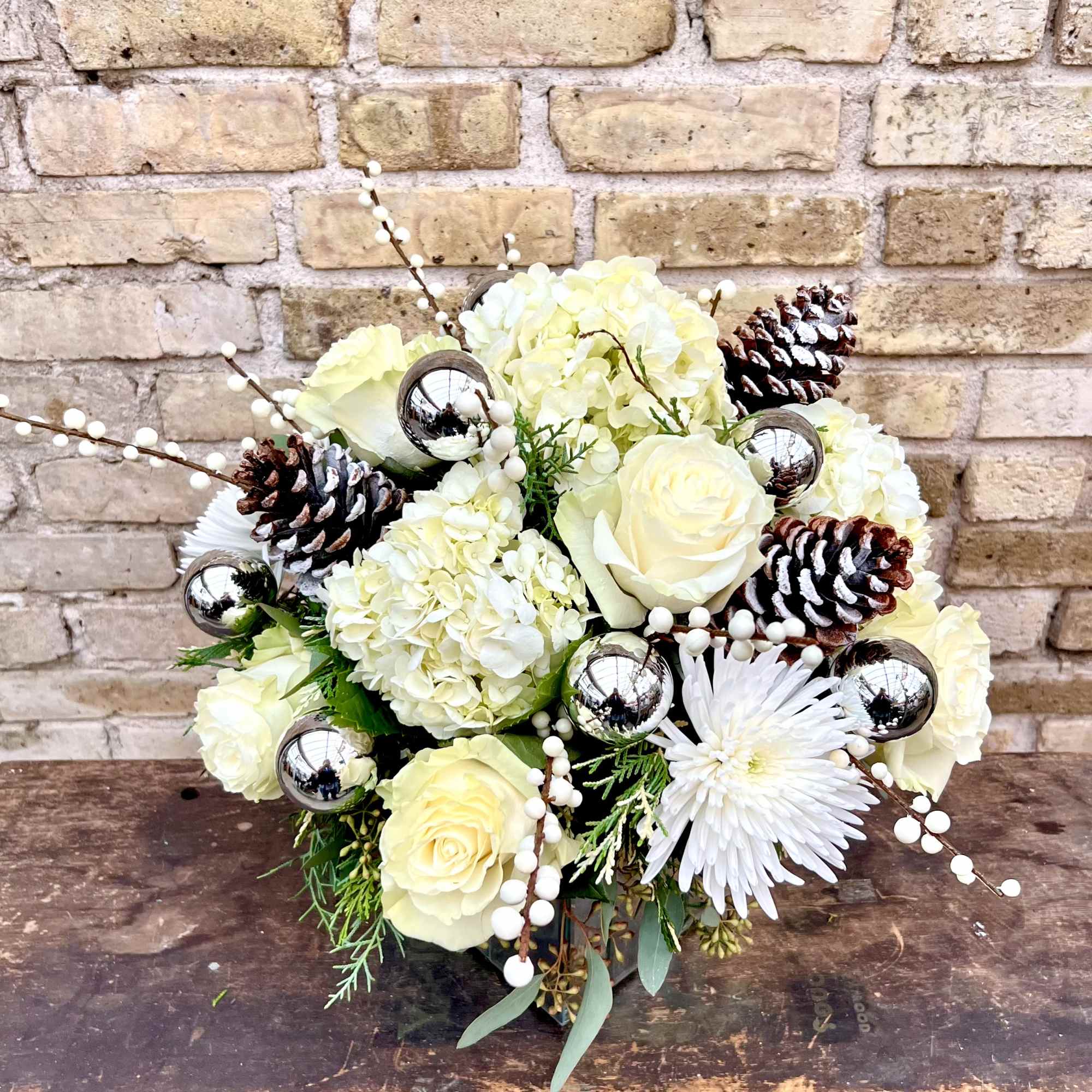 Mirrored Square Container Filled With Hydrangea, Roses,
Fuji Mums, Pine Cones and Holiday