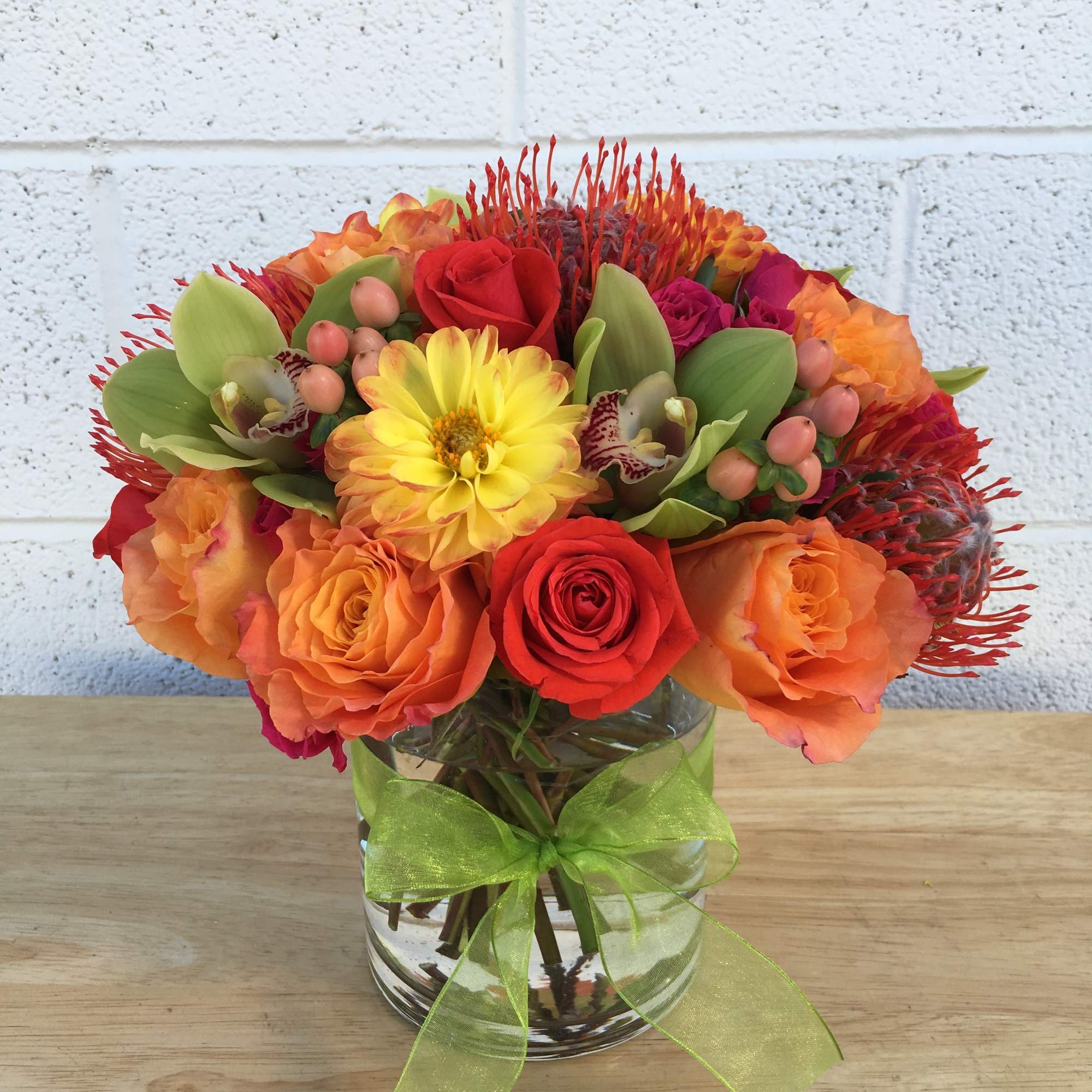 Vibrant and festive blooms in fall tones and textures.  Florals may