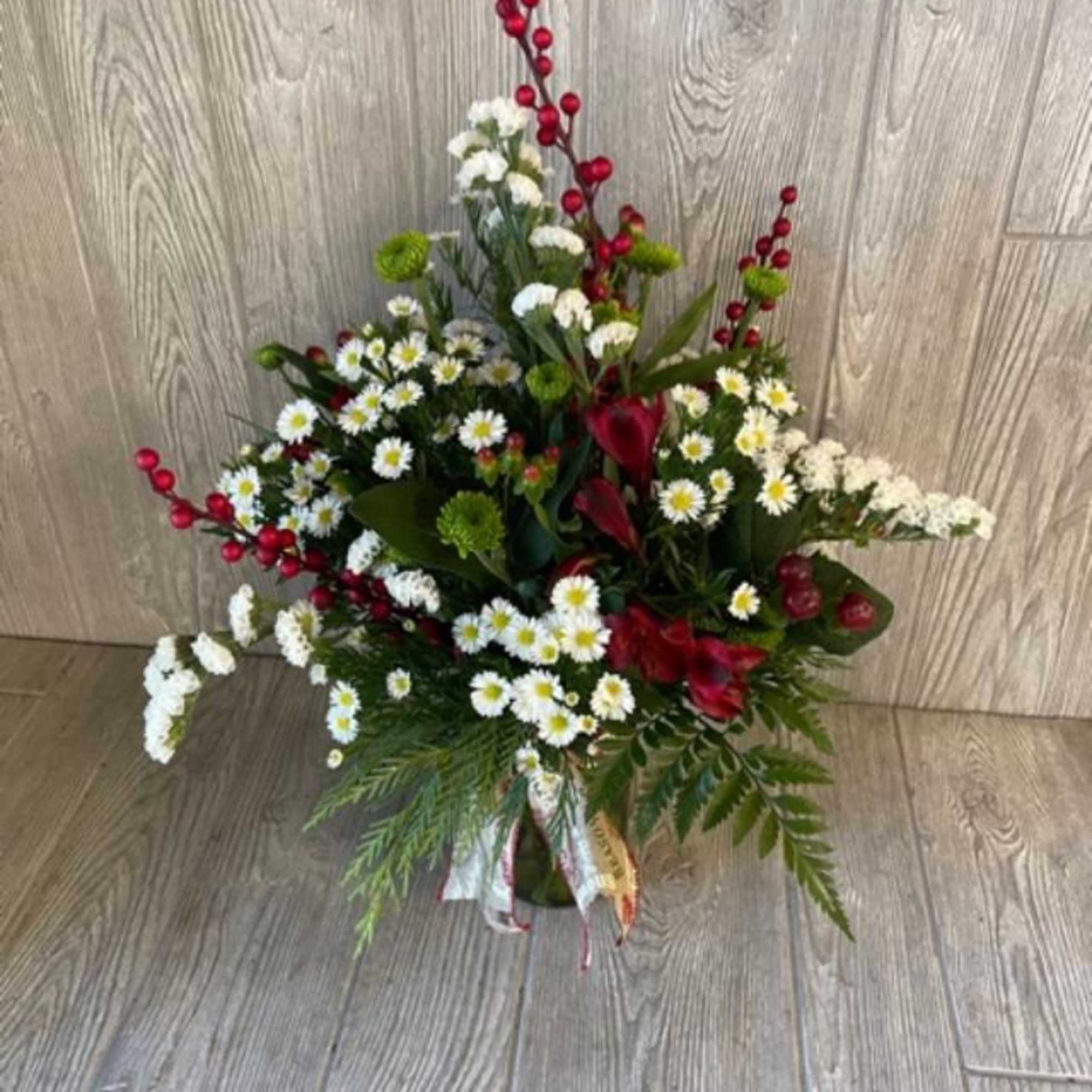 Mix of holiday flowers and greens.