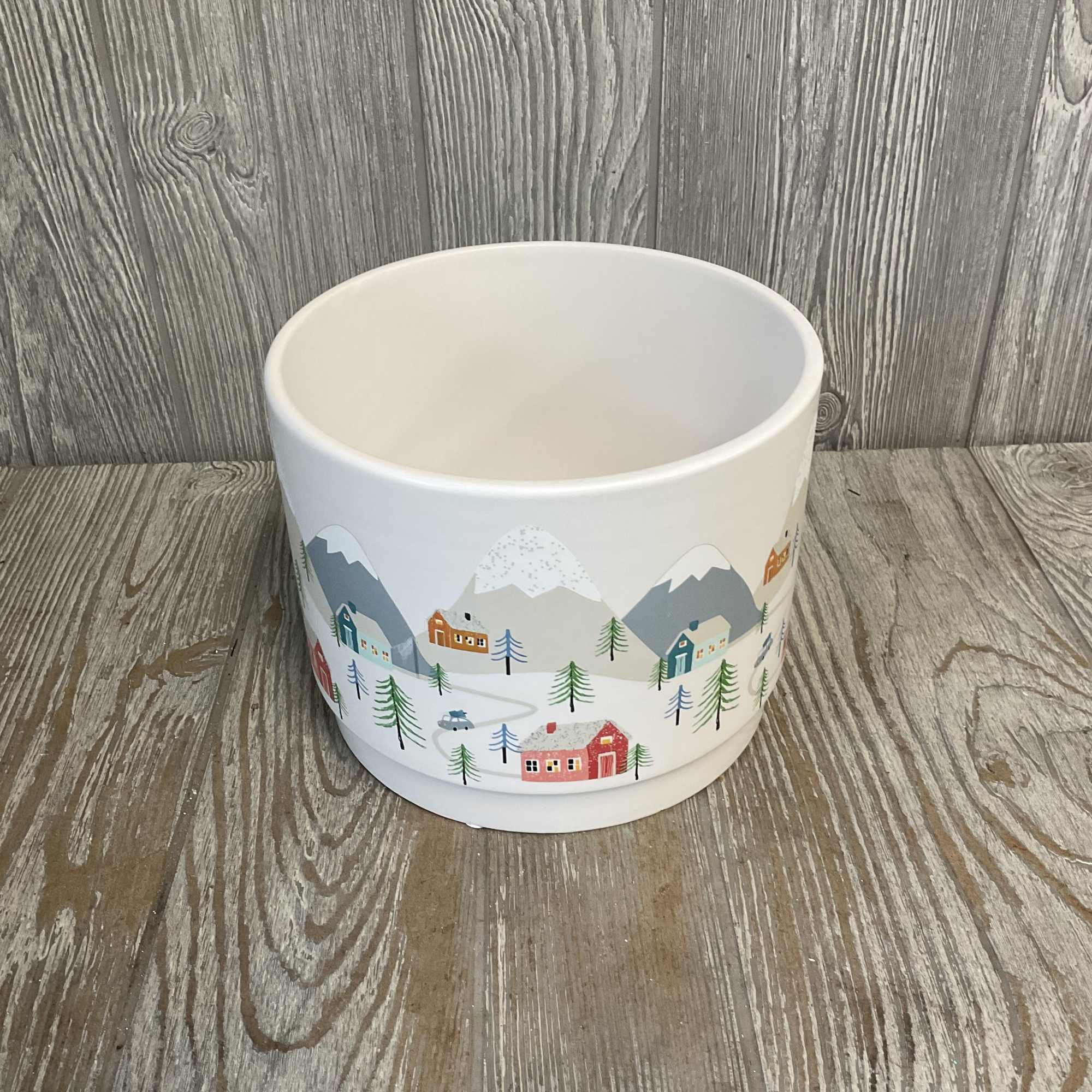 Enjoy the festive feelings of a white Christmas village in the comfort