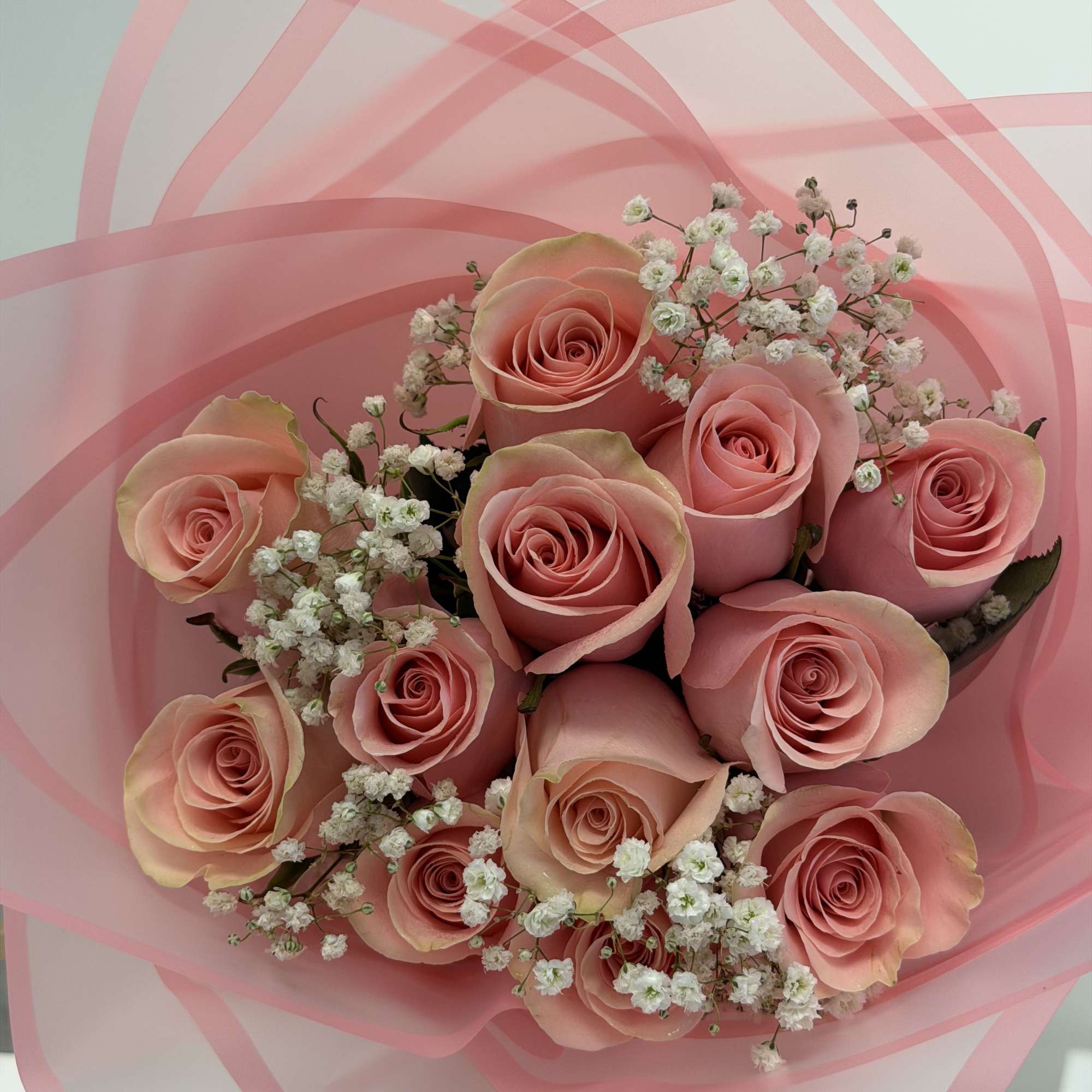 A sweet and stylish bouquet featuring twelve Pink Mondial roses in soft