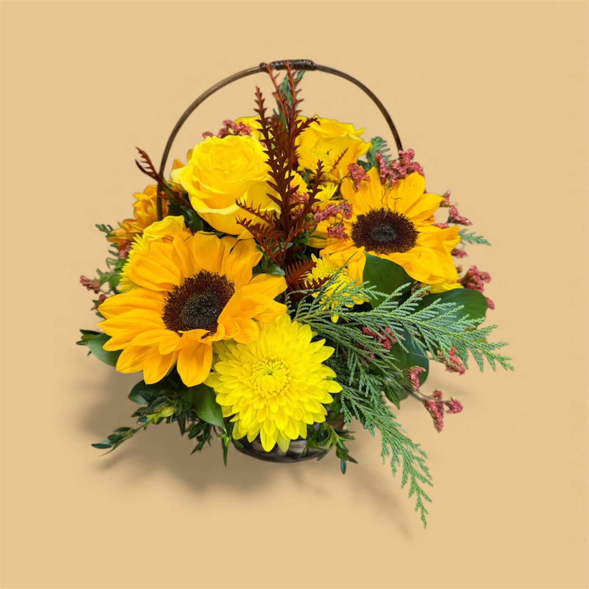 A traditional wicker basket bursting with fresh cut blooms artfully designed in
