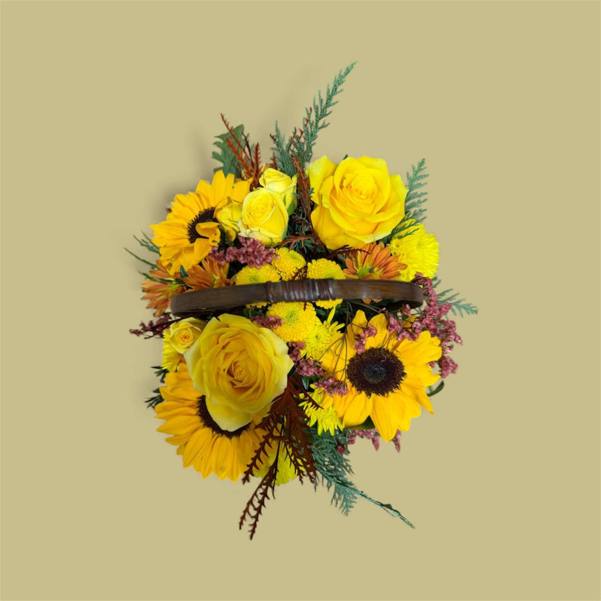 A traditional wicker basket bursting with fresh cut blooms artfully designed in