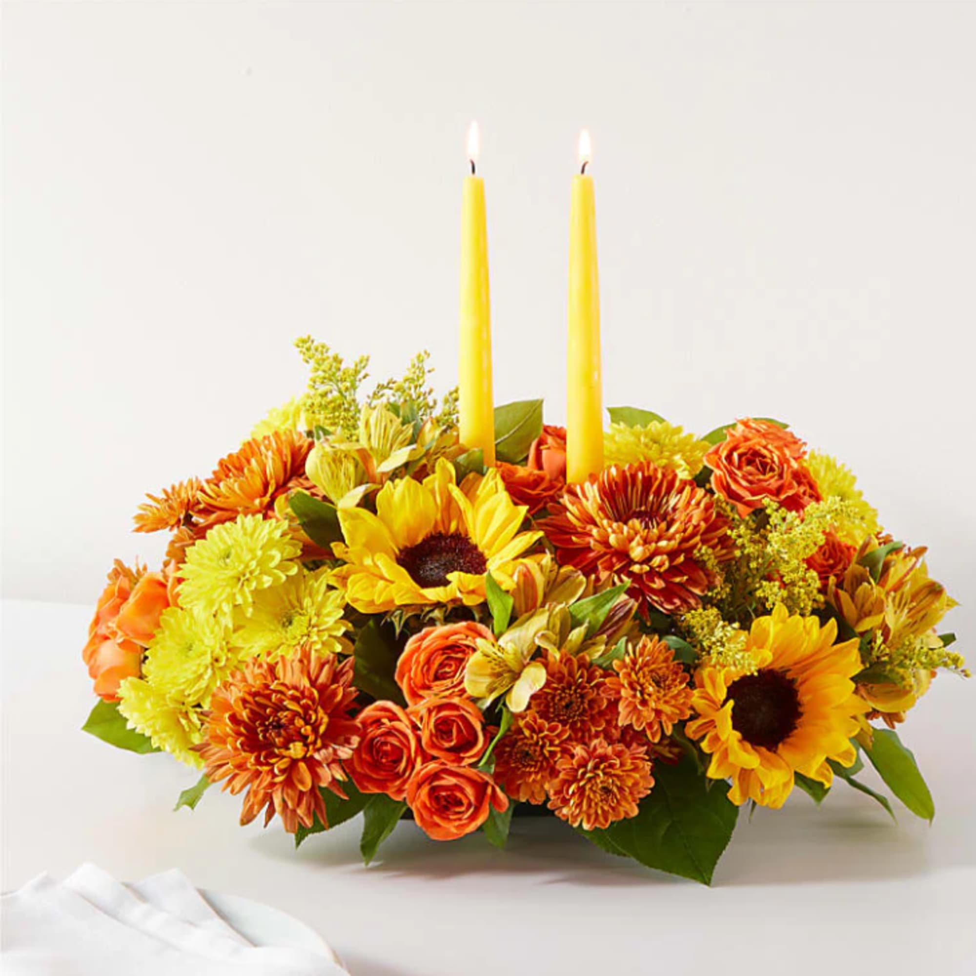 Enjoy a candlelit dinner with this colorful arrangement that embraces every shade