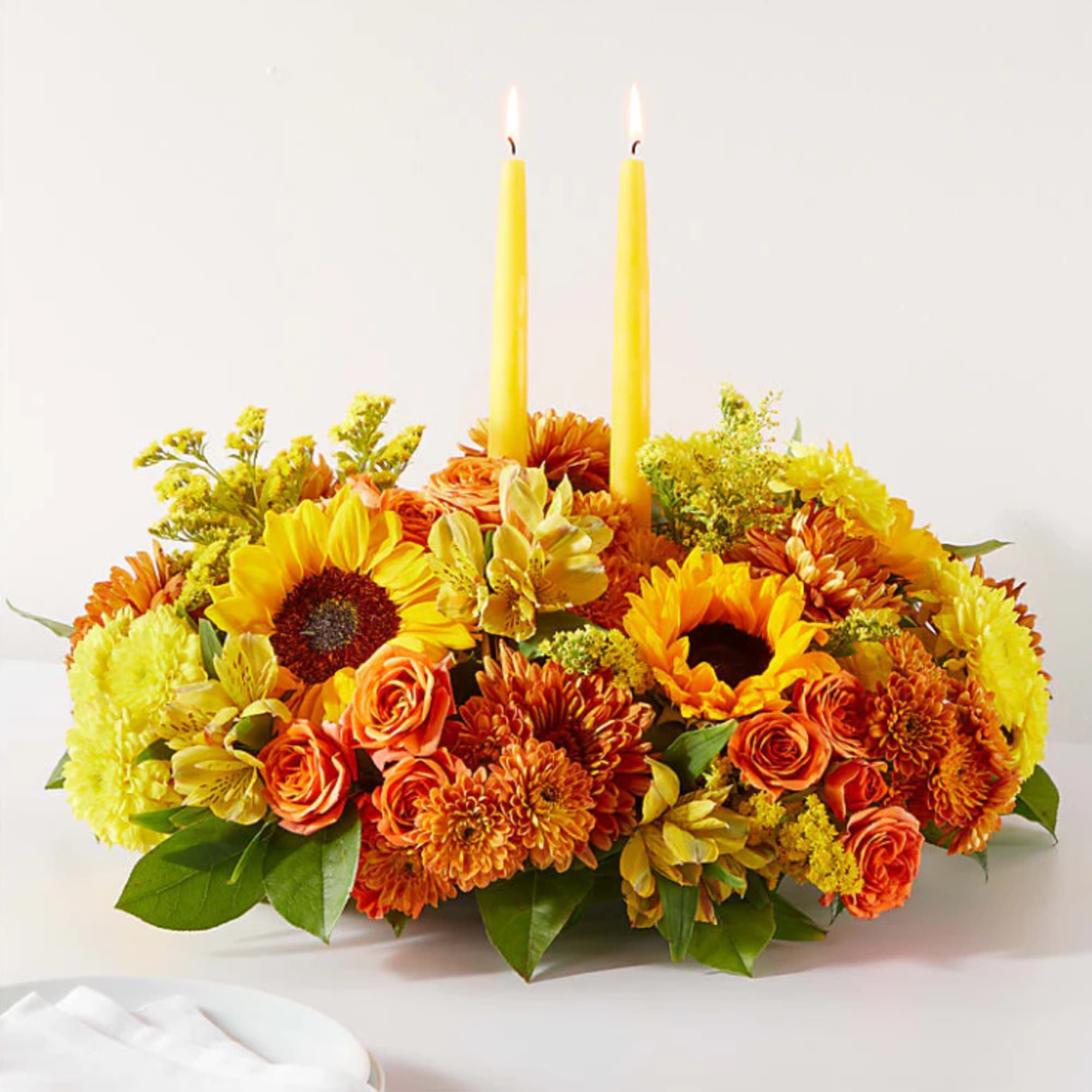 Enjoy a candlelit dinner with this colorful arrangement that embraces every shade