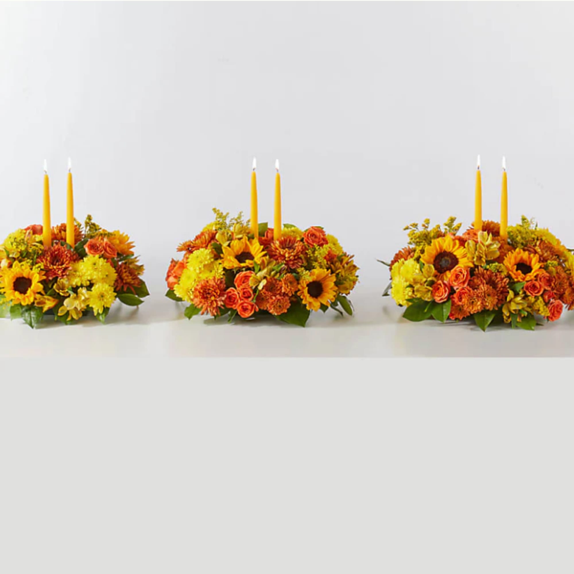 Enjoy a candlelit dinner with this colorful arrangement that embraces every shade