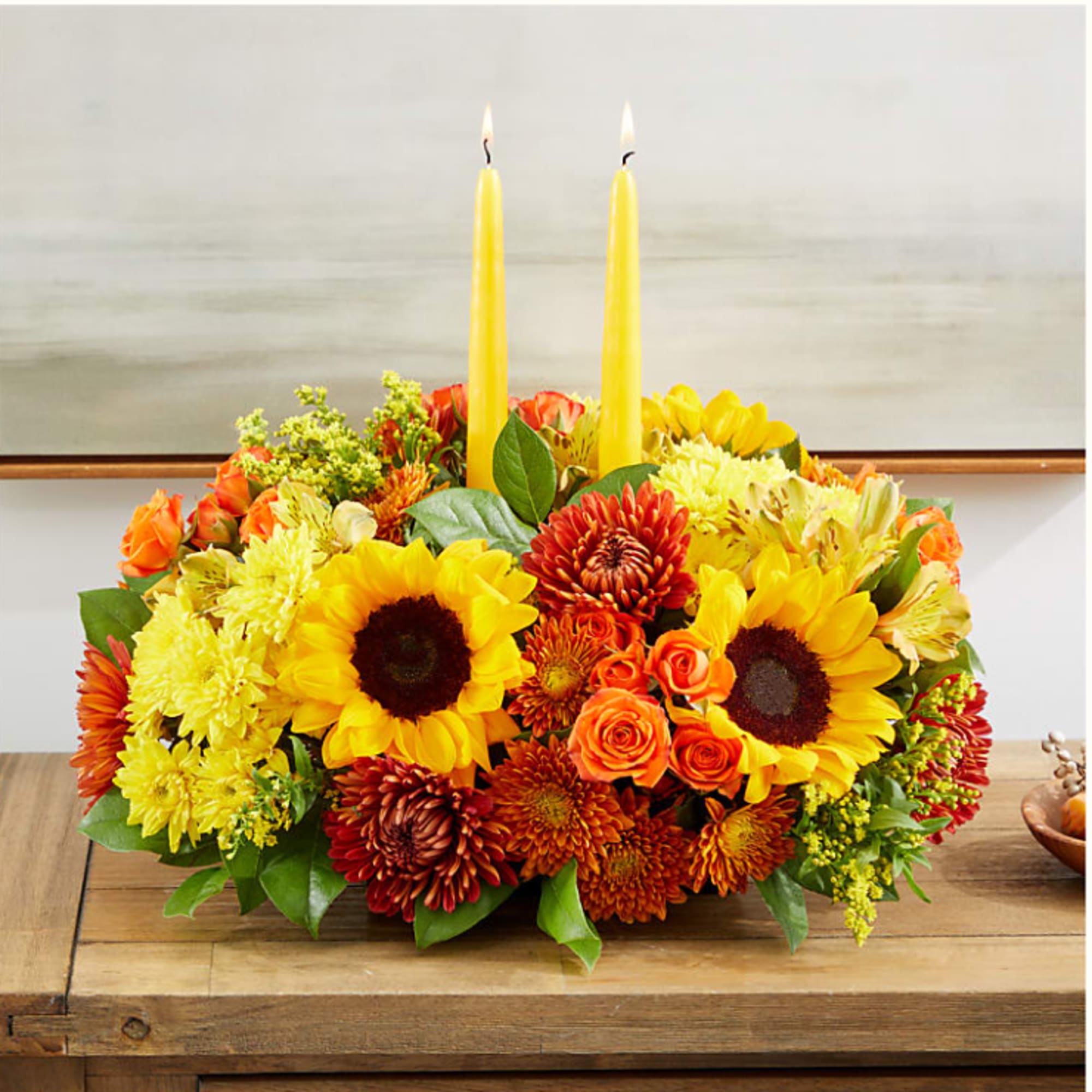 Enjoy a candlelit dinner with this colorful arrangement that embraces every shade