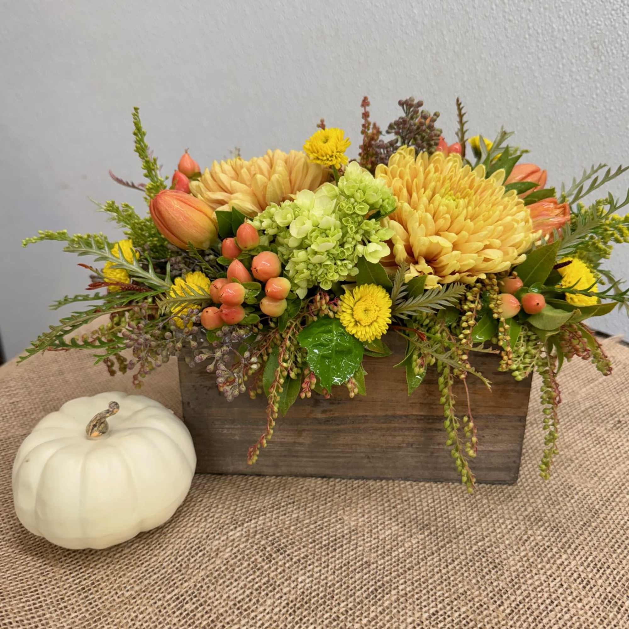 Wooden box with fresh seasonal flowers.