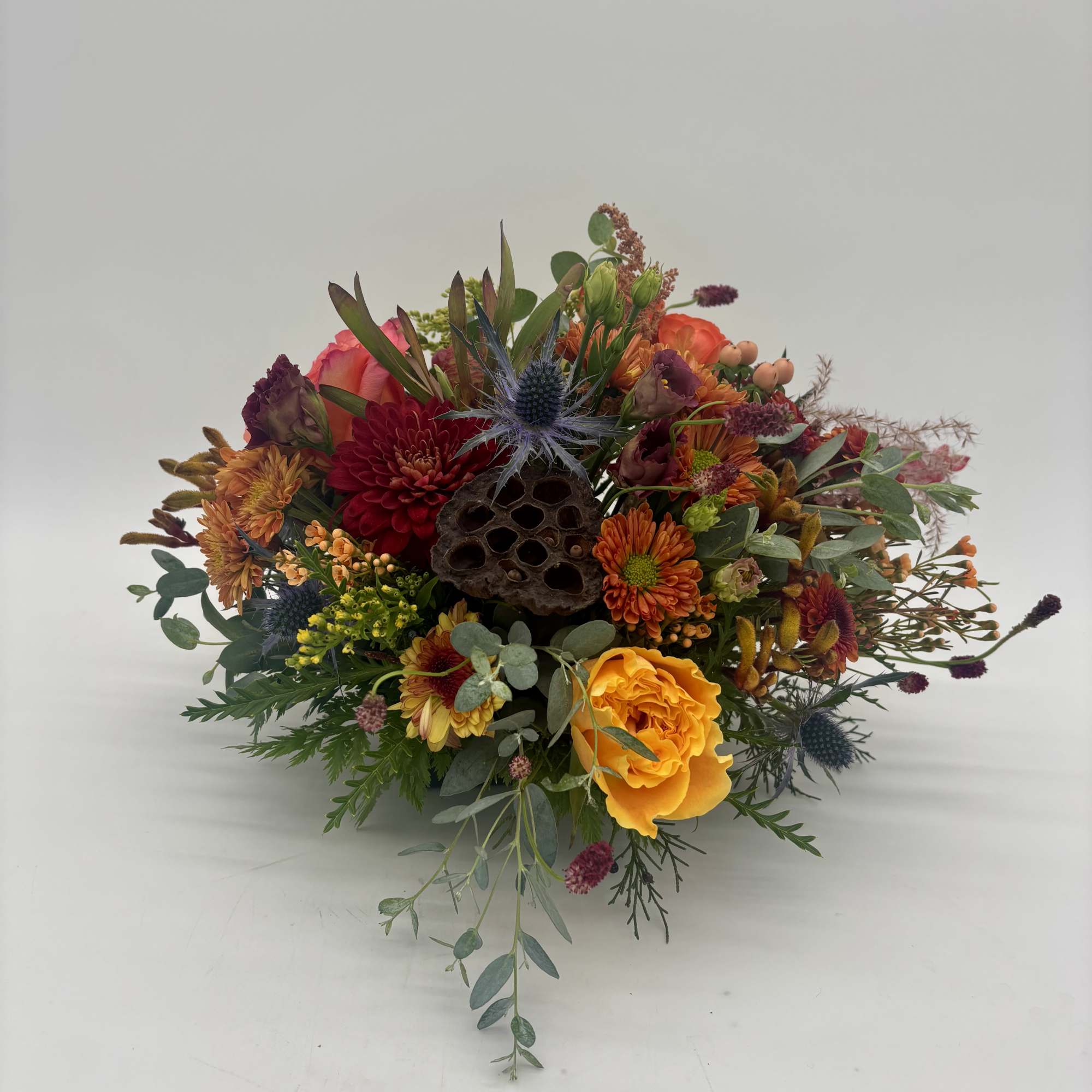 Traditional centerpiece made in 6&quot; designer dish. Included but not limited seasonal