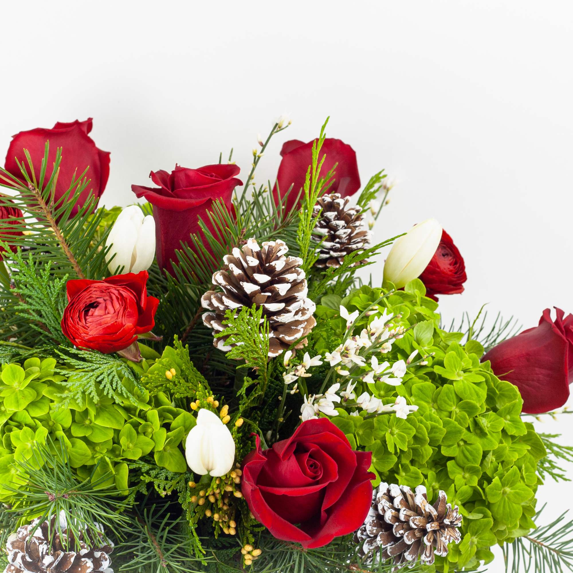 XMAS FLOWERS WITH RED ROSES, WHITE TULIPS &amp; RANUNCULUS 
Festive and bright.