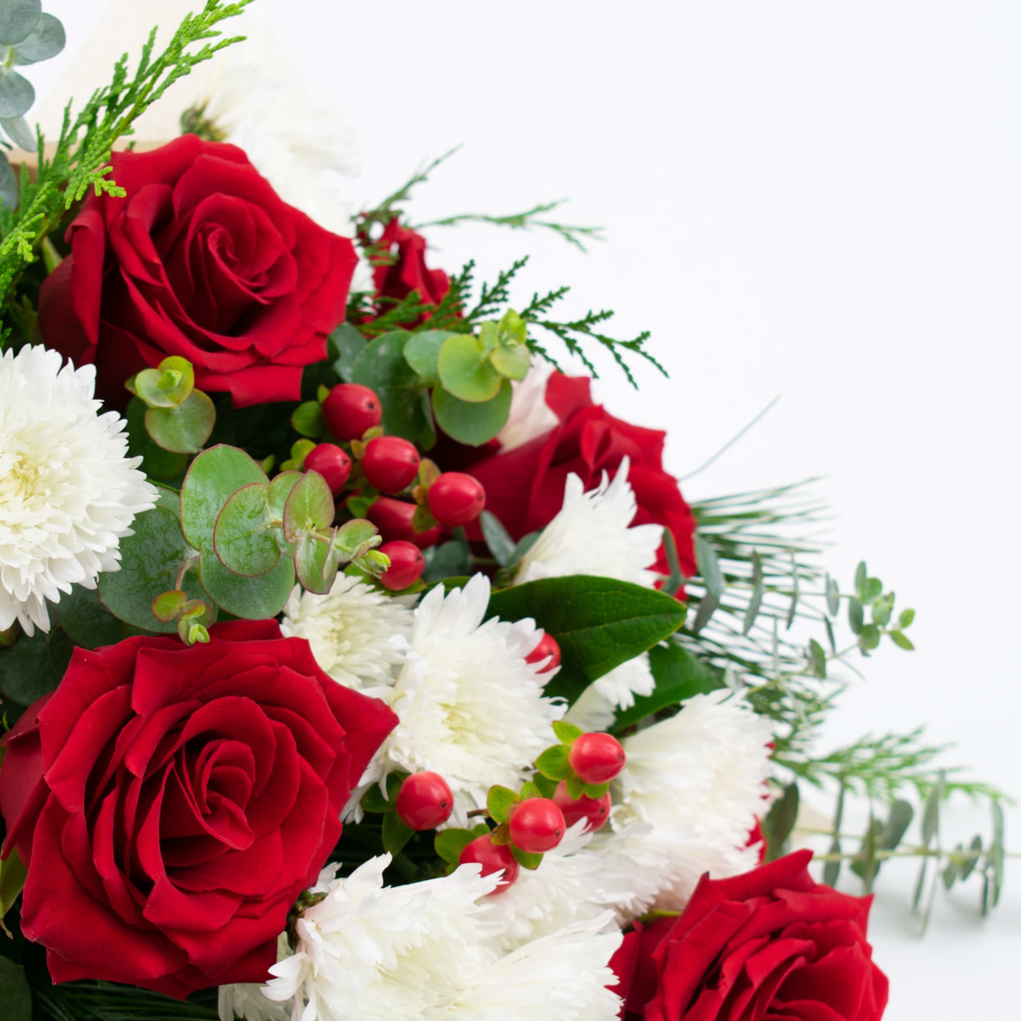 BEAUTIFUL CHRISTMAS FLOWER BOUQUET WITH RED ROSES AND BERRIES 

Bright and joyful.