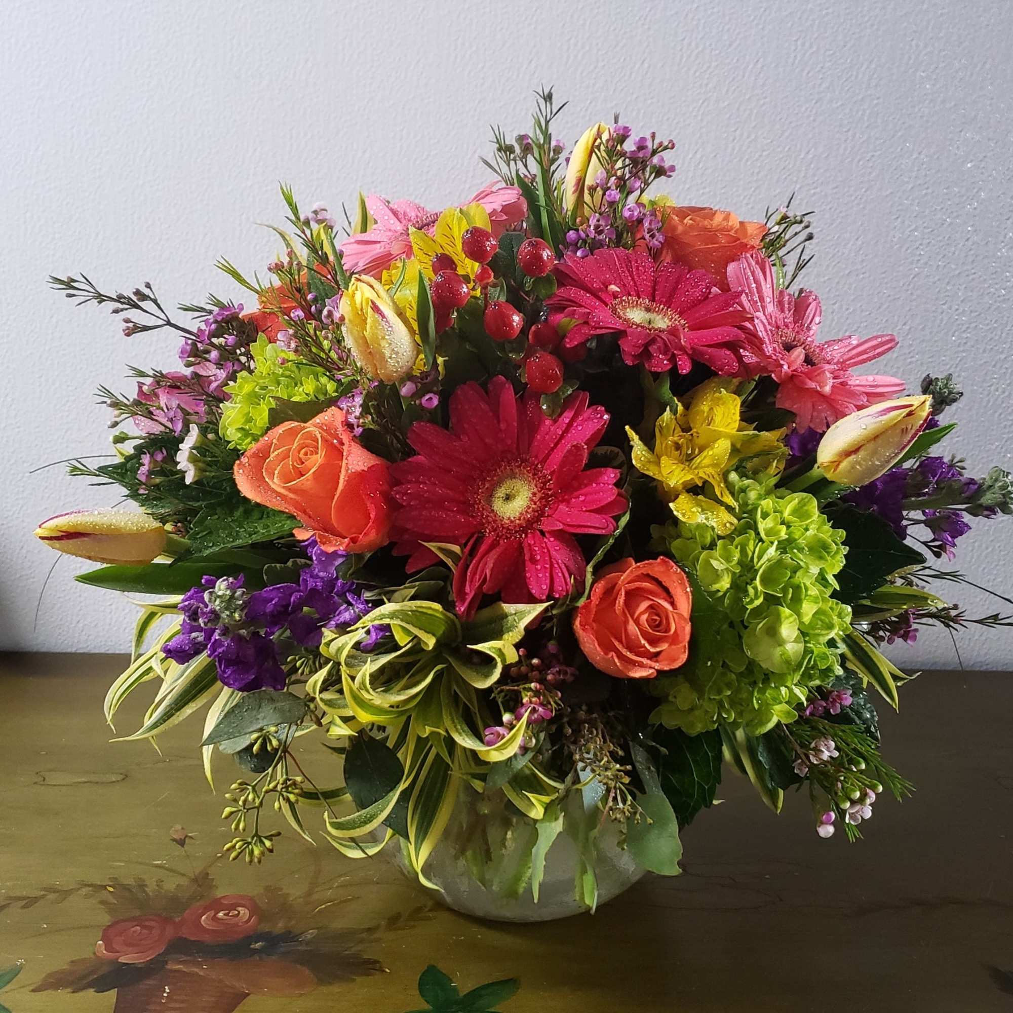 Elegant 8&quot; clear  glass bowl, filled with seasonal flowers such as