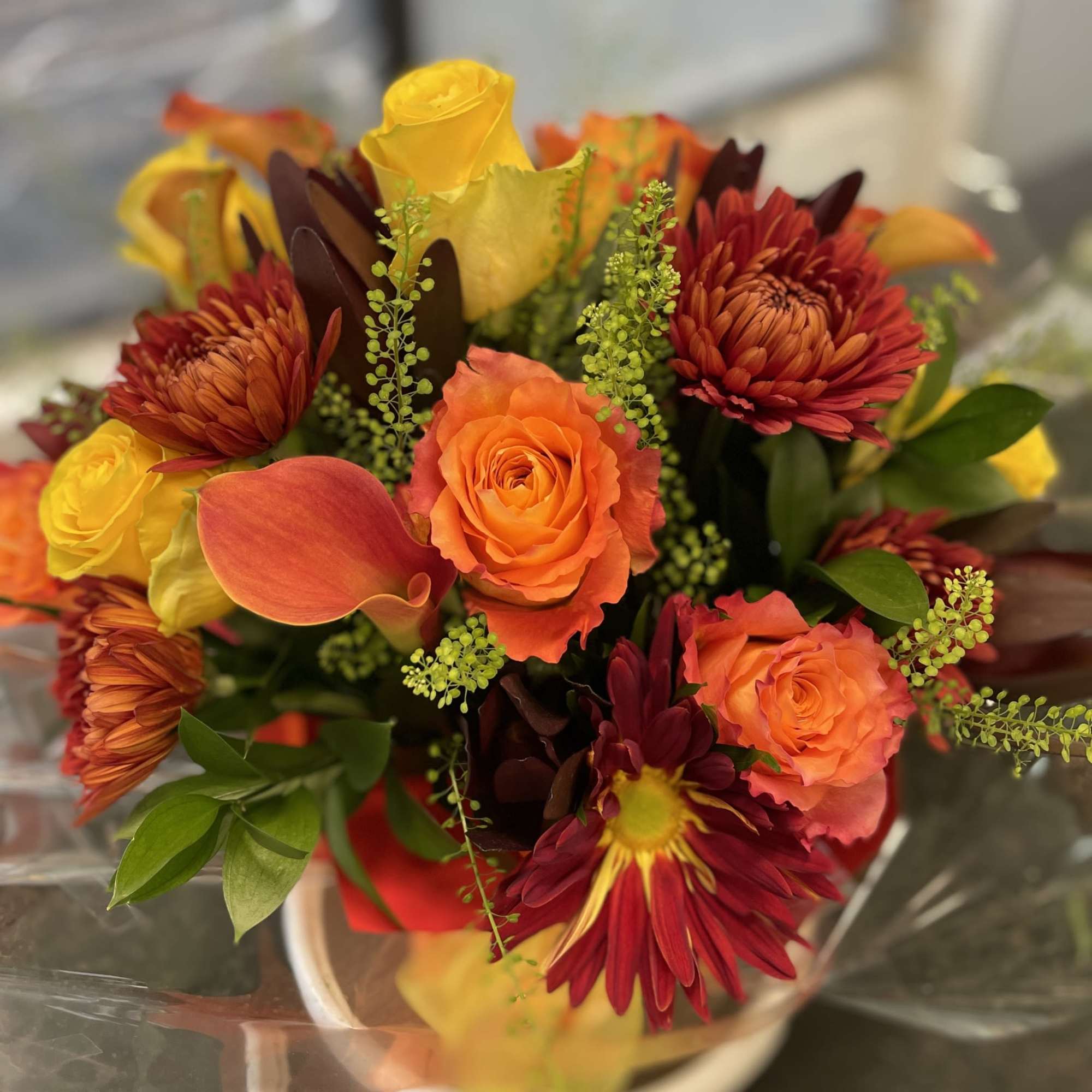 Arranged in a glass cylinder , and overall standing about 14 inches