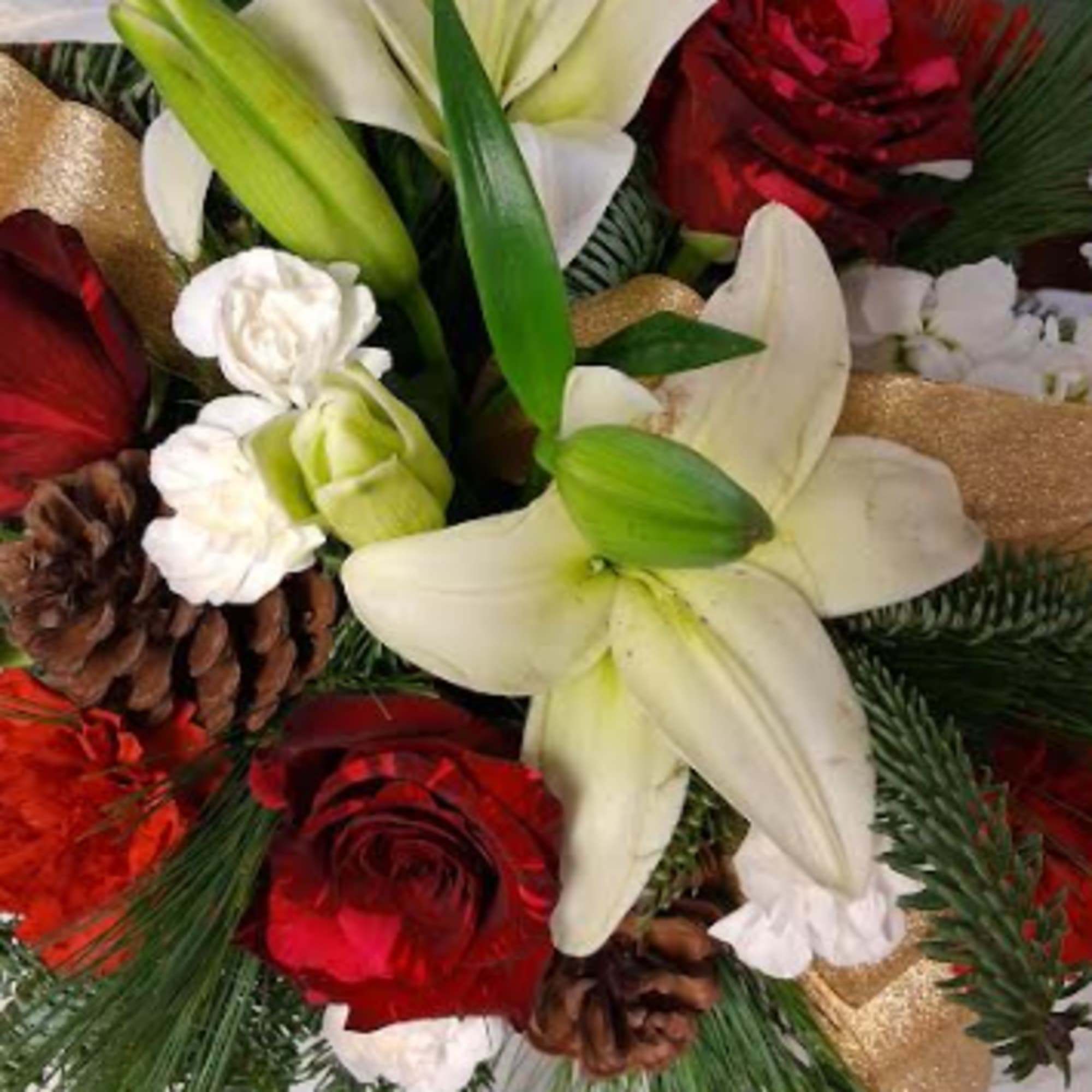 Designed in a striking red cube, this sophisticated Christmas arrangement brings timeless