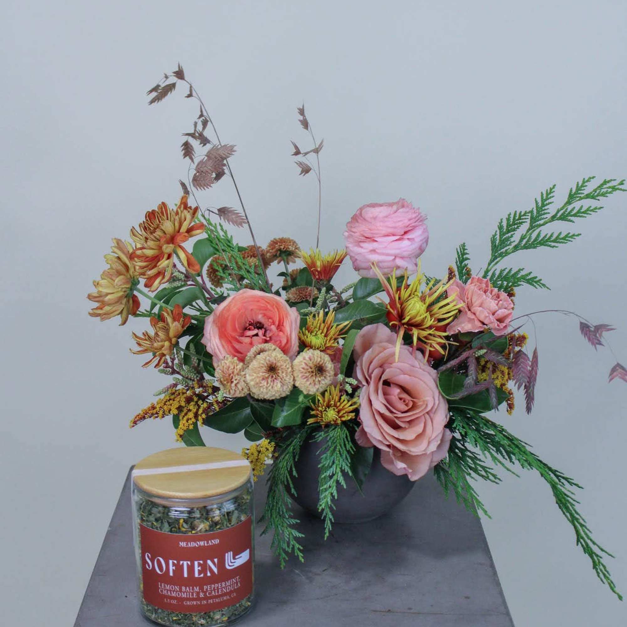 A gift bundle of winter floral and locally crafted tea, a perfect