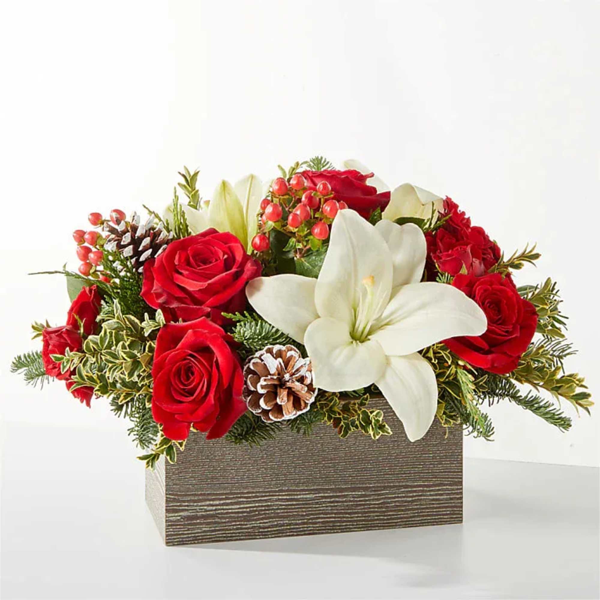  A snowy blend of red and white blooms makes this
bouquet the