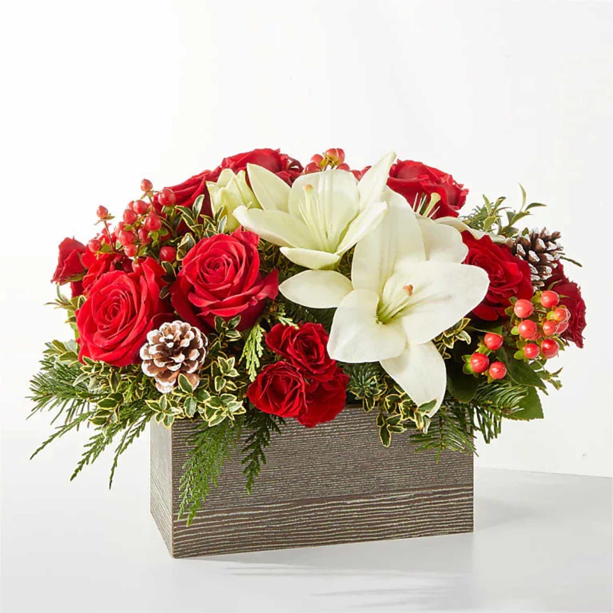  A snowy blend of red and white blooms makes this
bouquet the