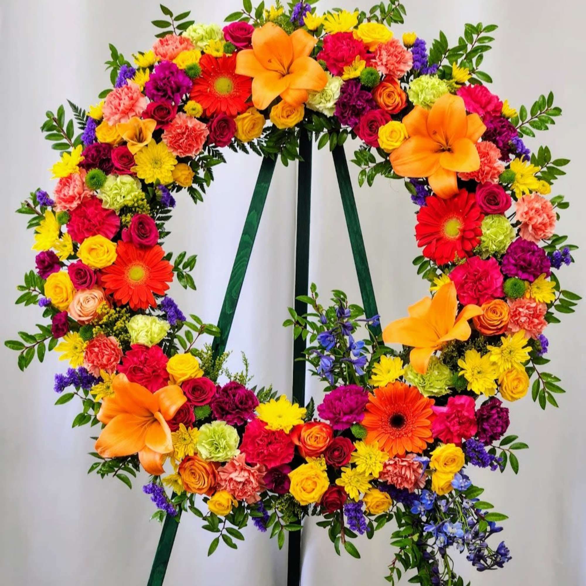 Celebrate joy and creativity with the Colorful Life Wreath. Its vibrant mix
